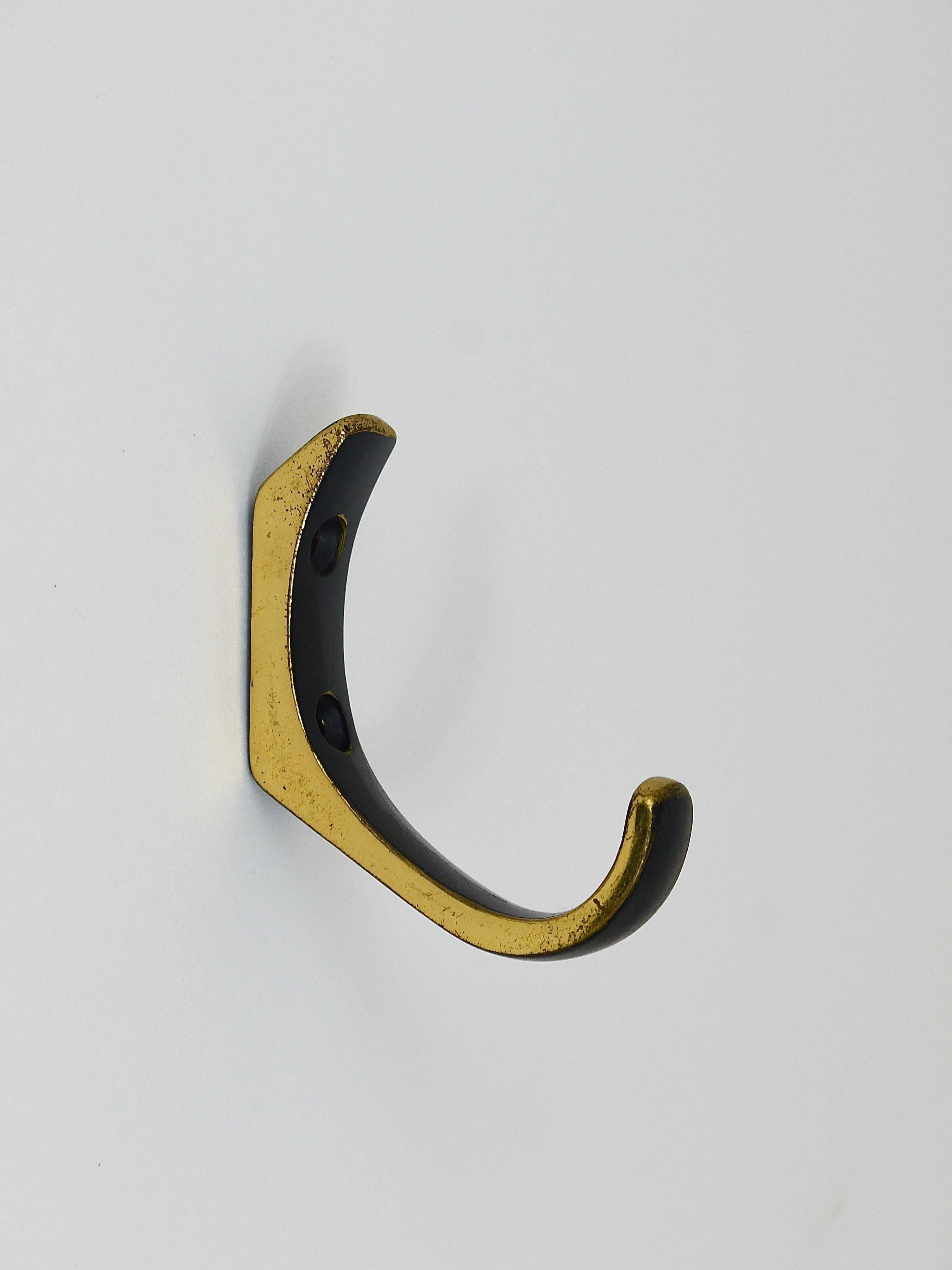 A set of up three large and two smaller modernist wall hooks, made of black-finished brass, executed in the 1950s by Hertha Baller, Austria. In very good condition, with marginal patina on the brass.

 