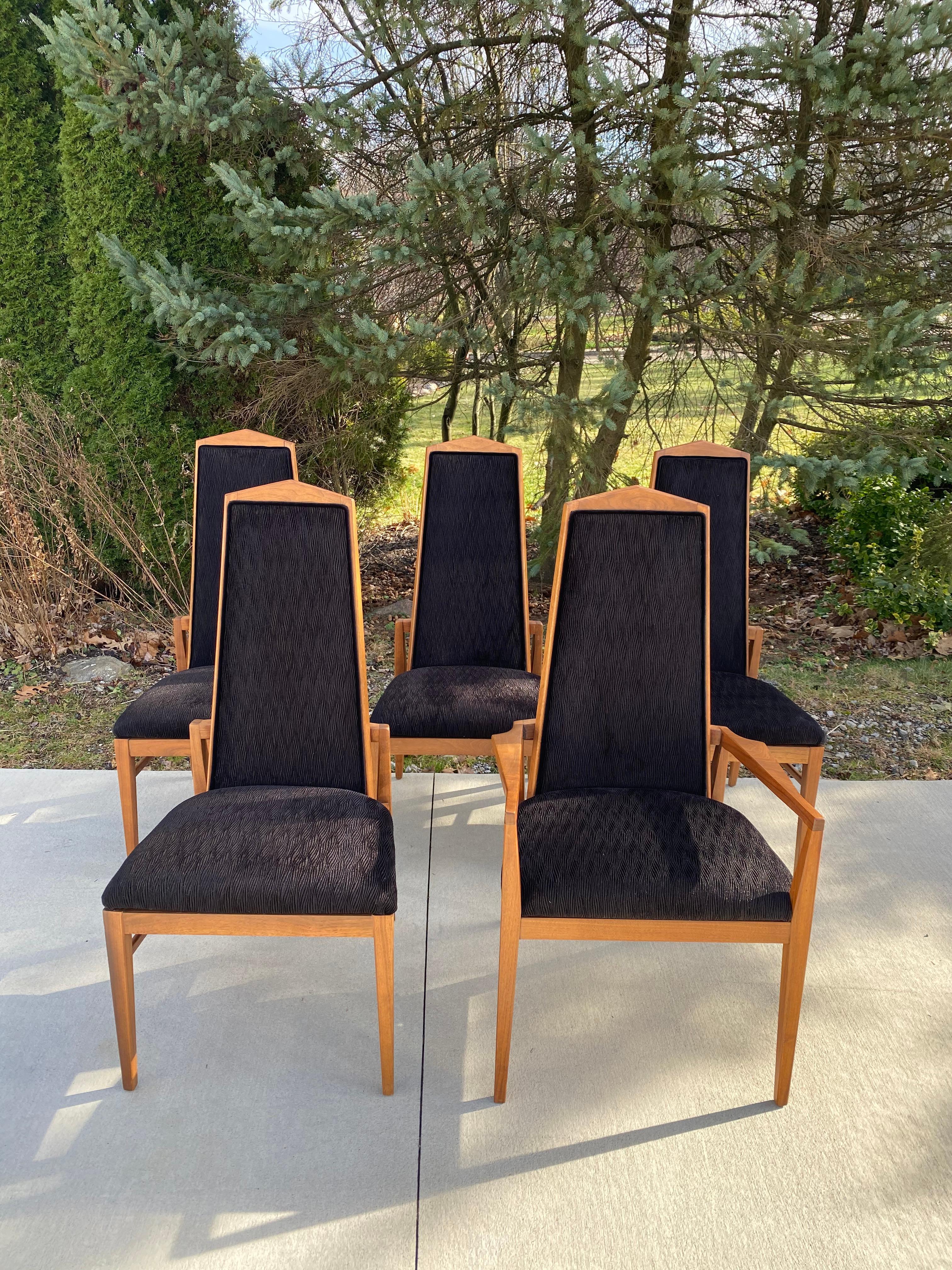 A set of five Foster & McDavid dining chairs, walnut, circa 1960s. Founded in Florida in 1950s. One arm chair and four side chairs. These chairs have been reupholstered in a beautiful textured black velvet fabric. If you take a look at the pictures,