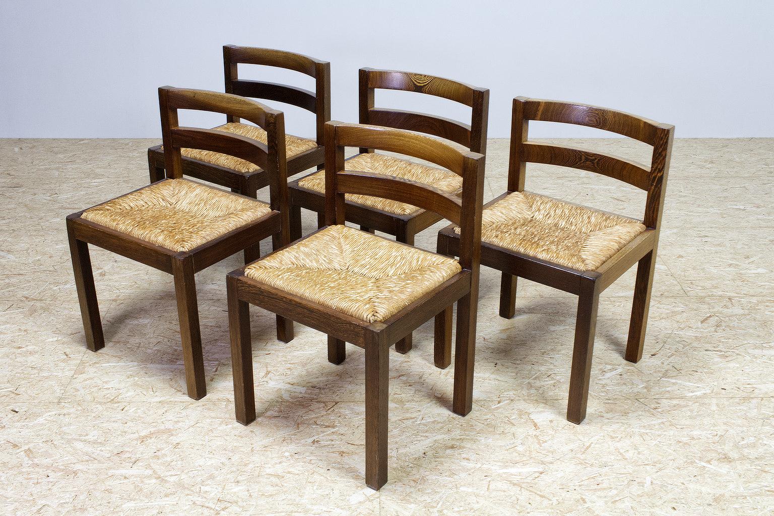 Midcentury Dutch dining room set in woven Rush (rattan like seating) and solid Wenge frame, Netherlands 1960s. A modest design with straight lines and angles, the back seat has a curve for comfort. The pieces are in good vintage condition, no