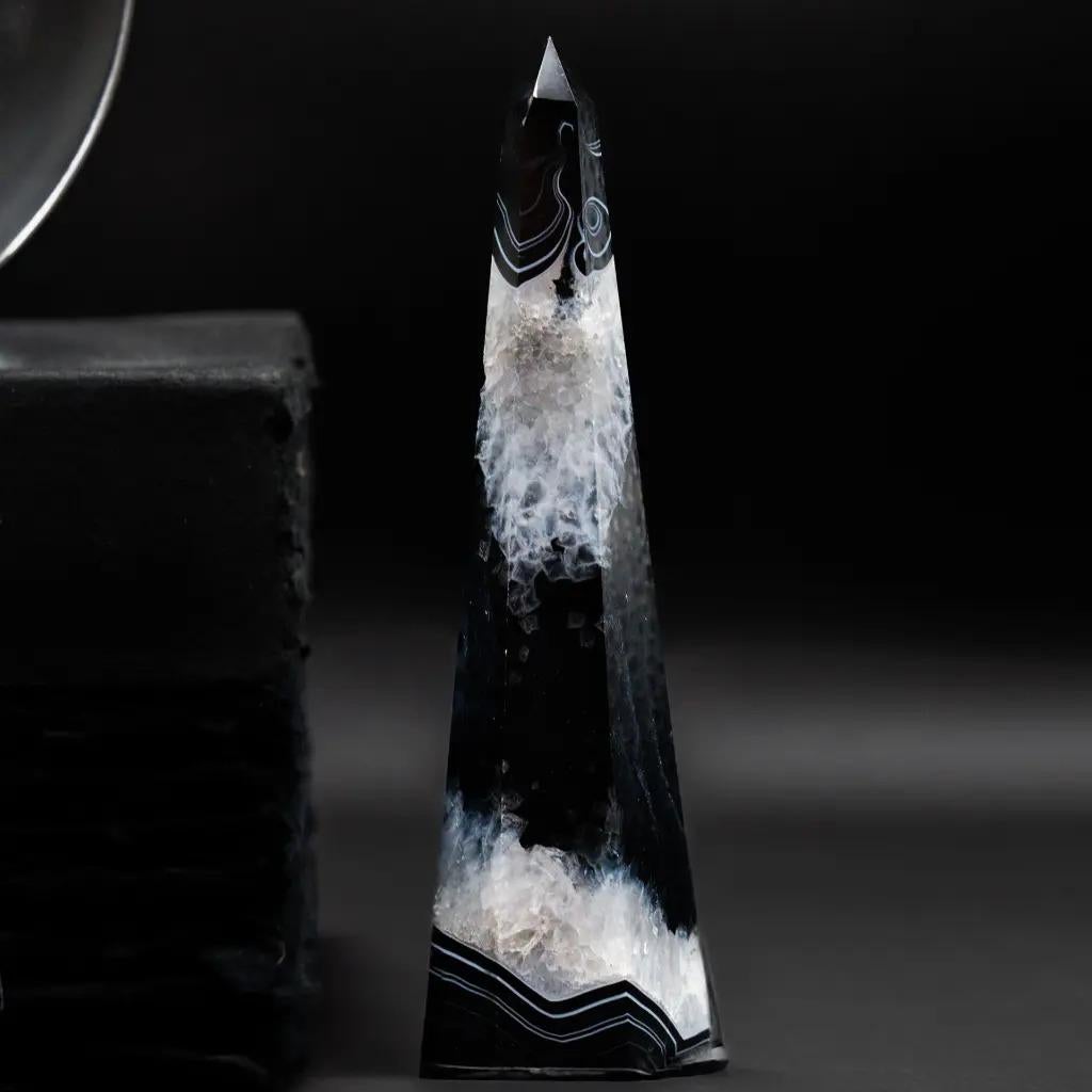 Bring sophistication and protective energy to your interior with this set of five black agate obelisks. Each piece is unique, revealing the deep, intense beauty of this natural stone.

Black agate is a semi-precious stone celebrated for its rich,