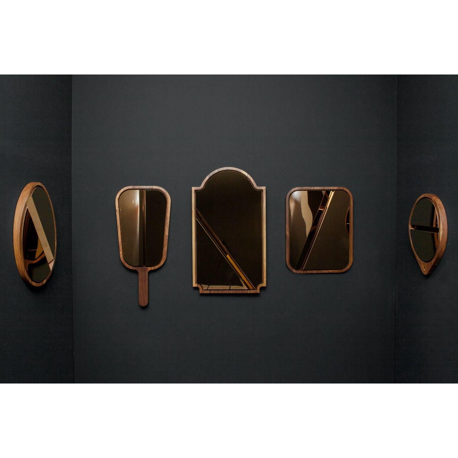 Set of 5 please don't tell mom mirrors by Marc Dibeh
2015
Materials: American walnut, Polished Stainless Steel, Rose Gold Finish
Dimensions: W48 x H66 x D4 cm 
W48 x H90 x D4 cm
W56 x H93 x D4 cm
W55 x H60 x D4 cm
W46 x H52 x D4 cm

This