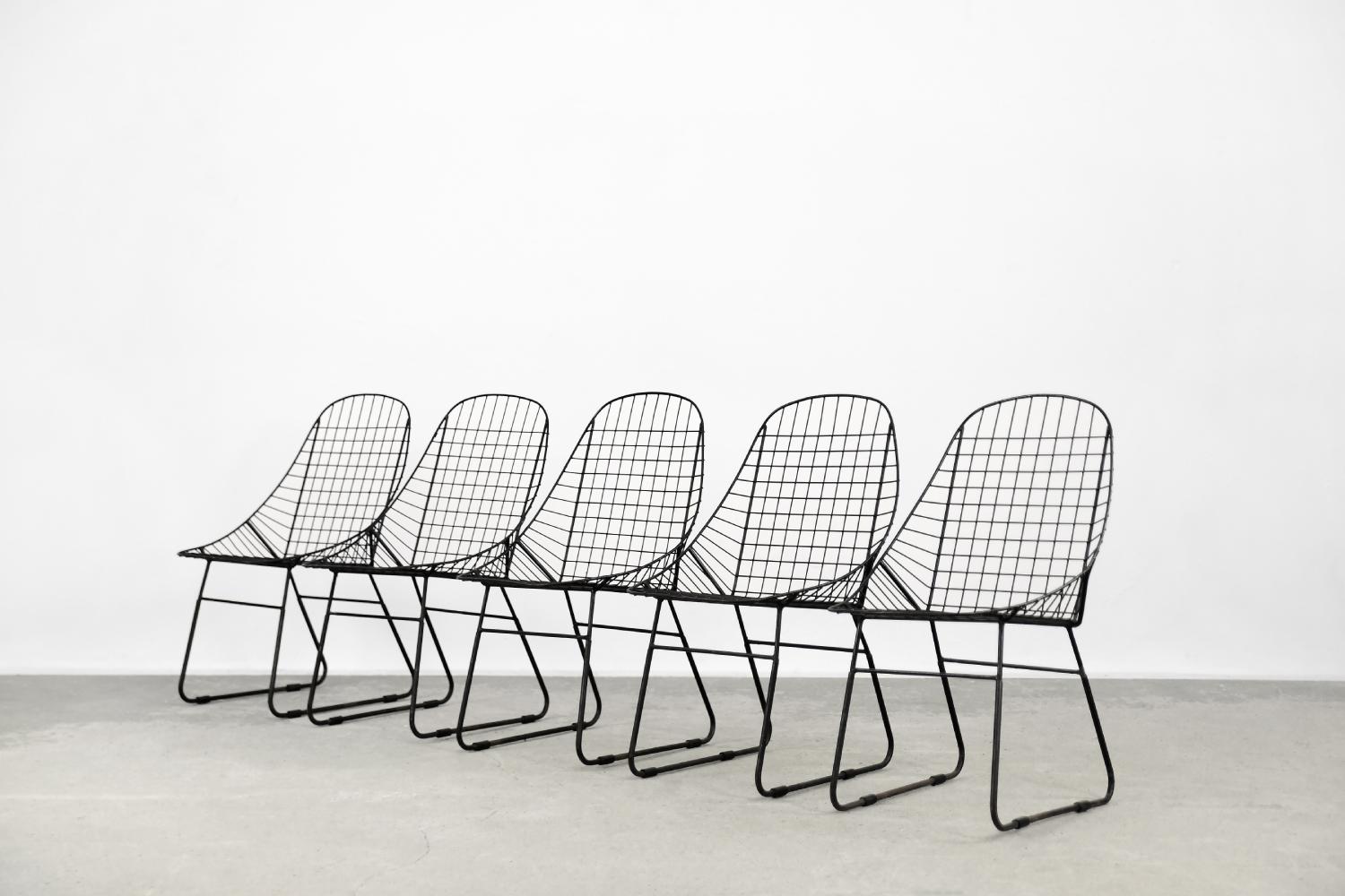 This set of five minimalist chairs was designed during the 1960s. It is probably a prototype made by a Swedish manufactory, and the chairs never entered mass production. They have a solid frame made of black coated metal wire. The form refers to the