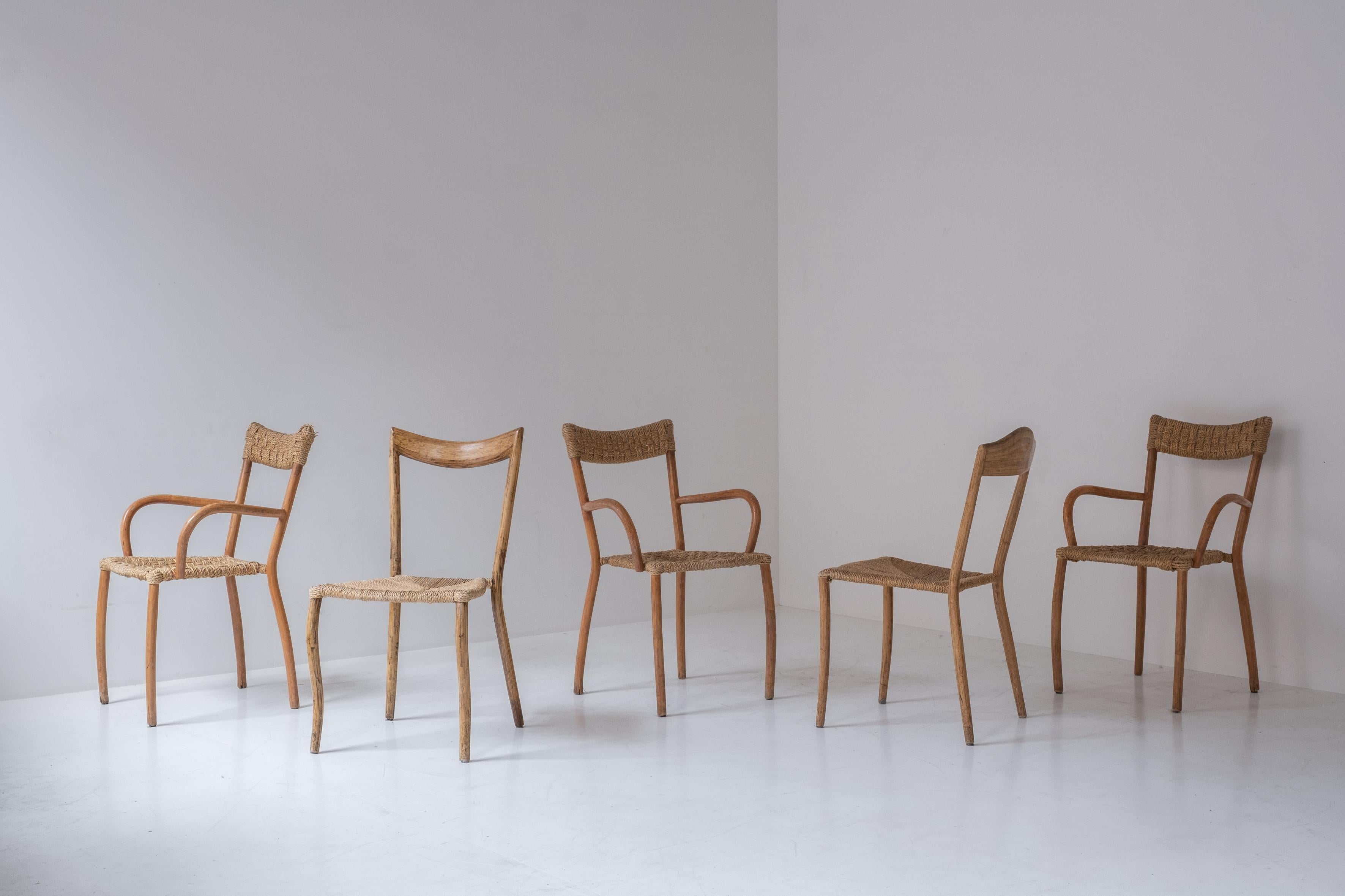 Set of 5 sculptural dining chairs from France, designed in the 1960s. These chairs have paper cord seats and are slightly different from each other. Some age related marks, but overall in a good vintage condition