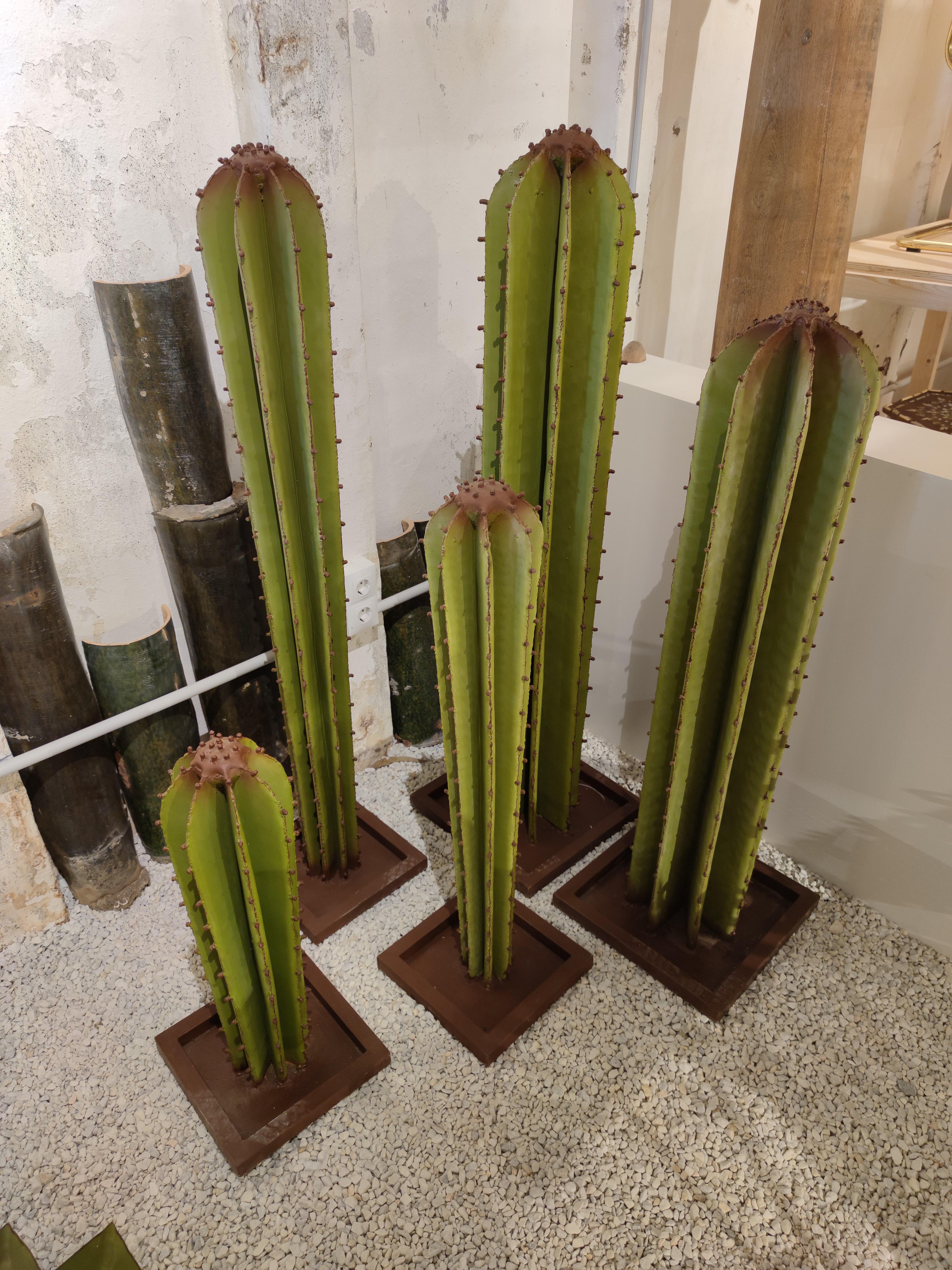 Contemporary set of 5 Spanish hand painted cactus iron sculptures.