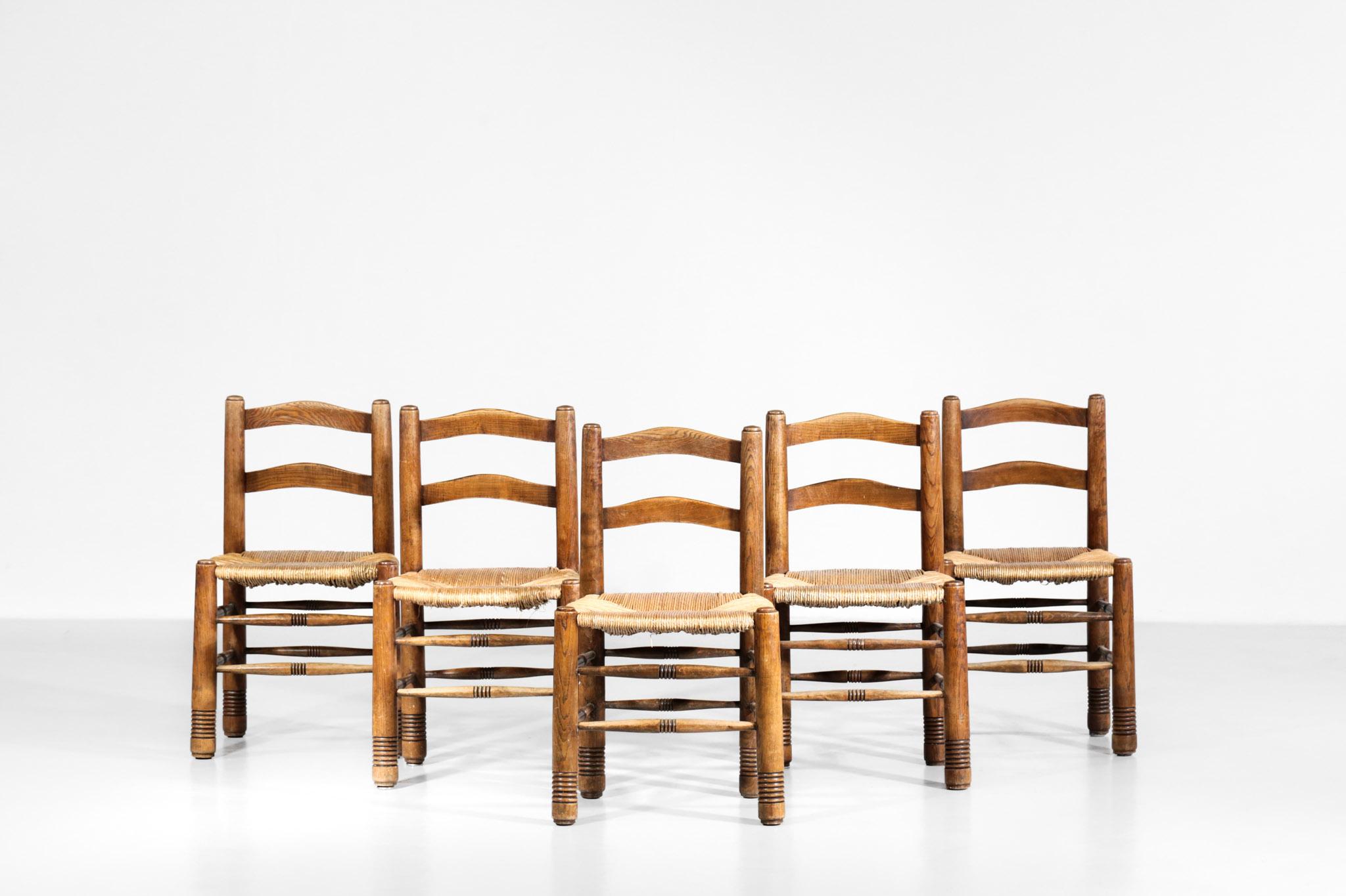 Set of 5 straw chairs in the style of Charles Dudouyt. Structure in massive oak with straw as a seat.