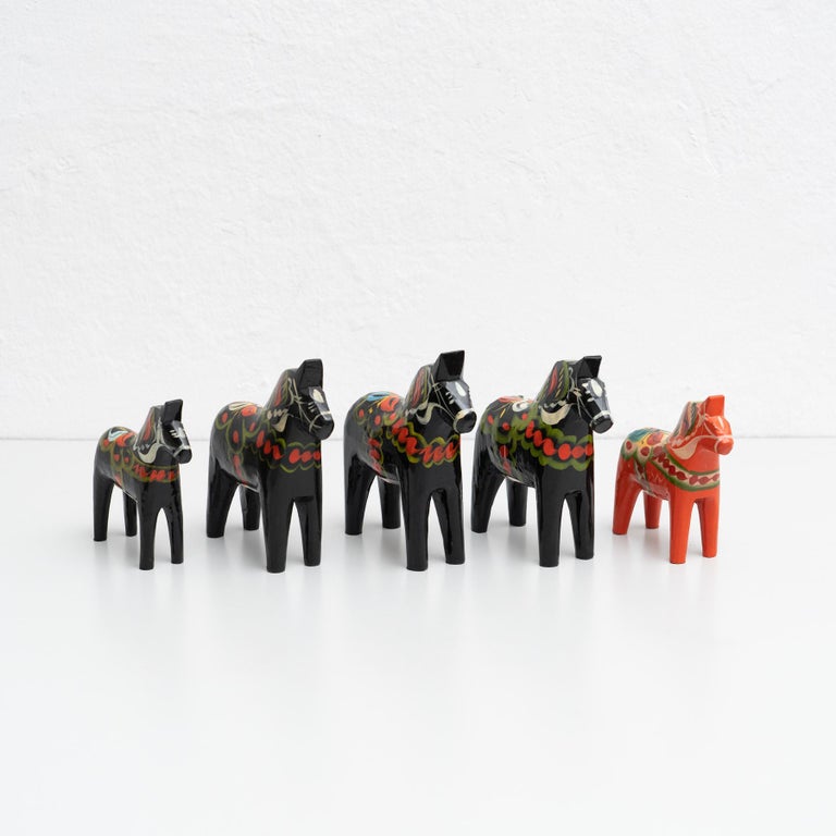 Set of 5 handpainted Swedish wooden traditional Dala horse toy.

Designed by Nils Olsson in Sweden, circa 1960.
Materials:
Wood

In original condition, with minor wear consistent with age and use, preserving a beautiful patina.

Dimensions:
50 H 49