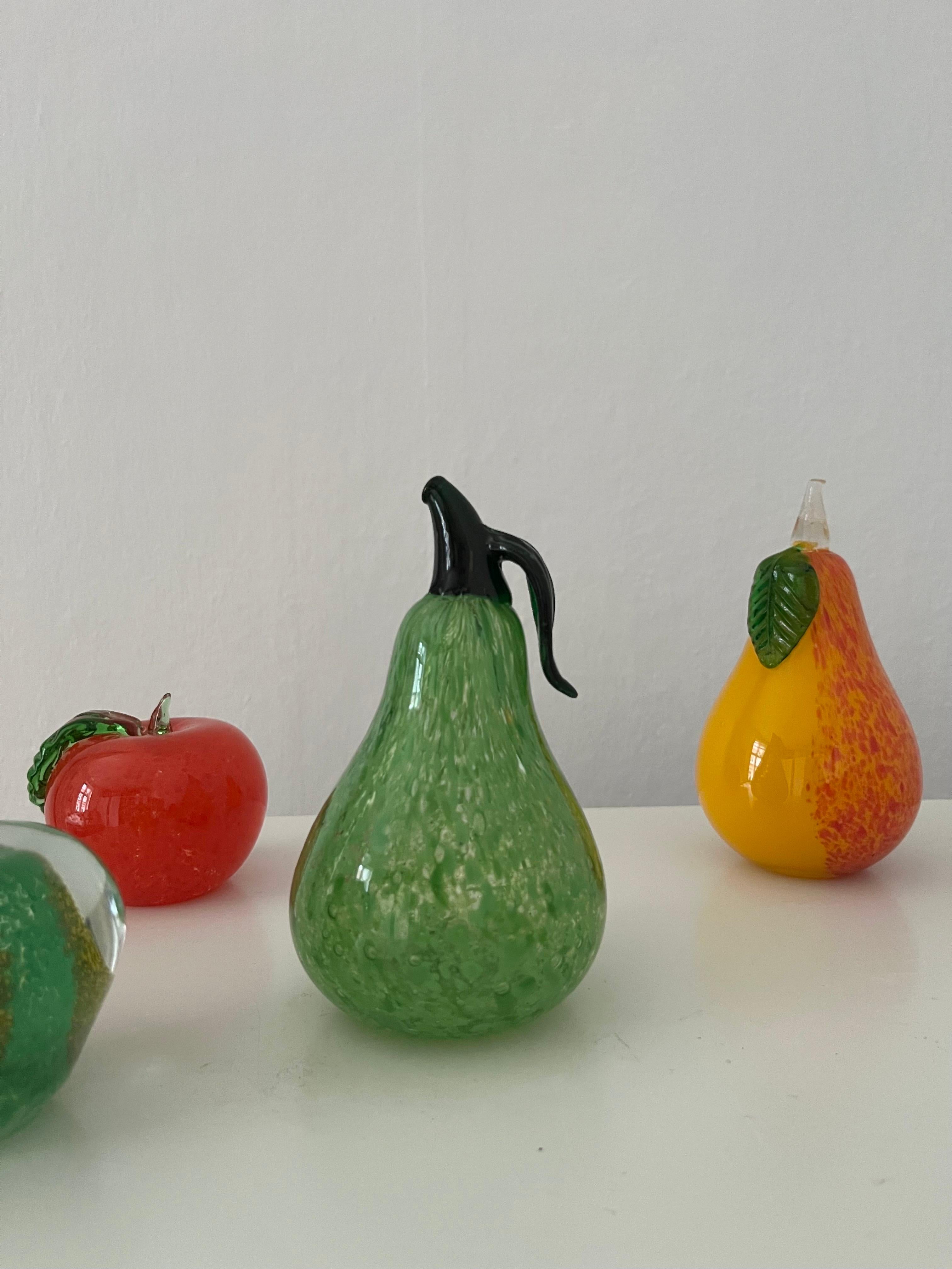 Set of 5 vintage heavy decorative glass fruits. Swedish glass art. 
Elevate your space with this set of five meticulously crafted glass treasures, each measuring between 7 and 12 cm. This collection features enchanting representations of 2 pears, 2