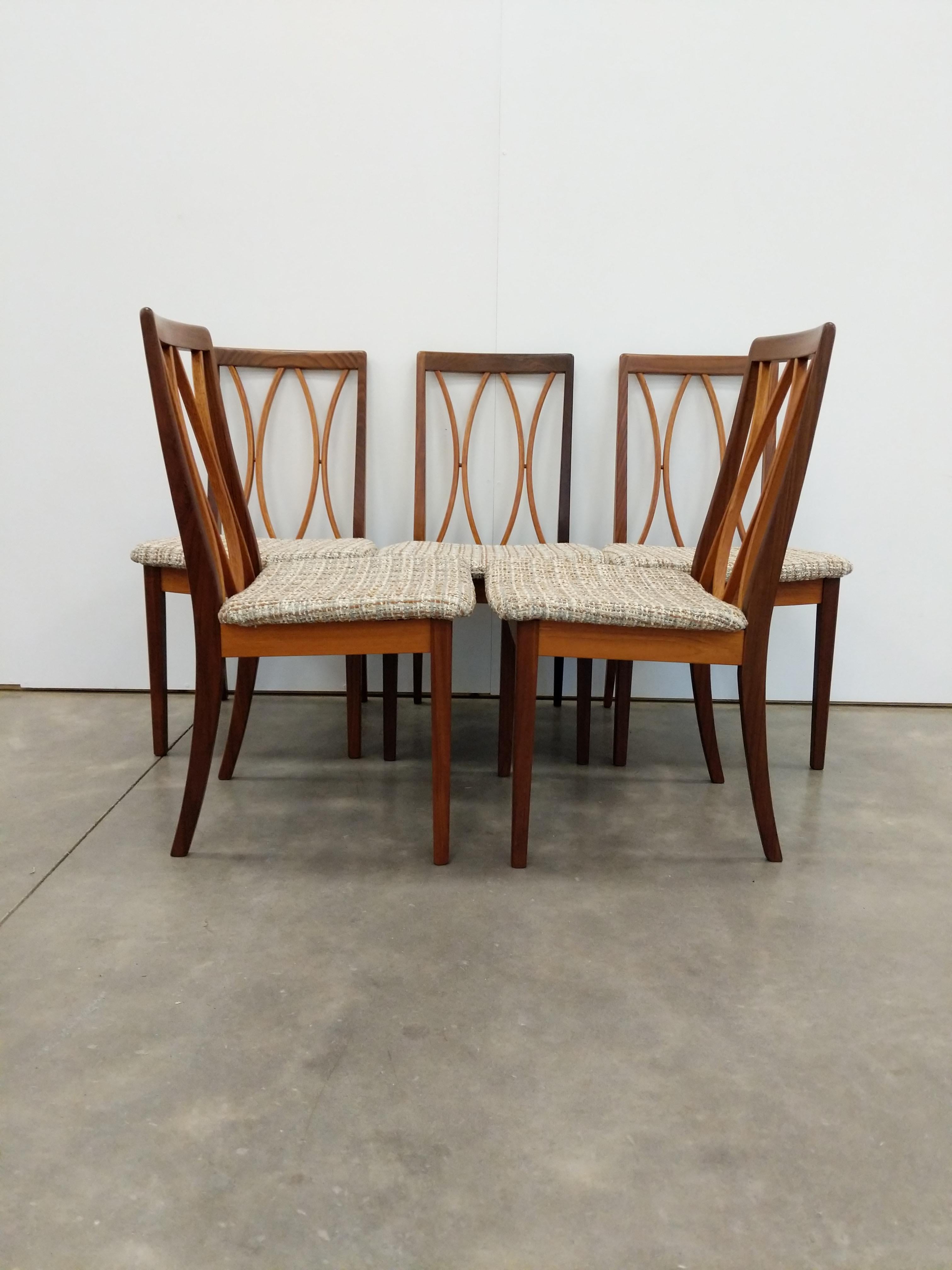 Set of 5 authentic vintage mid century modern dining chairs.

By G Plan.

Maker's label on bottoms.

This set is in excellent condition with brand new upholstery and very few signs of age-related wear (see photos).

If you would like any additional