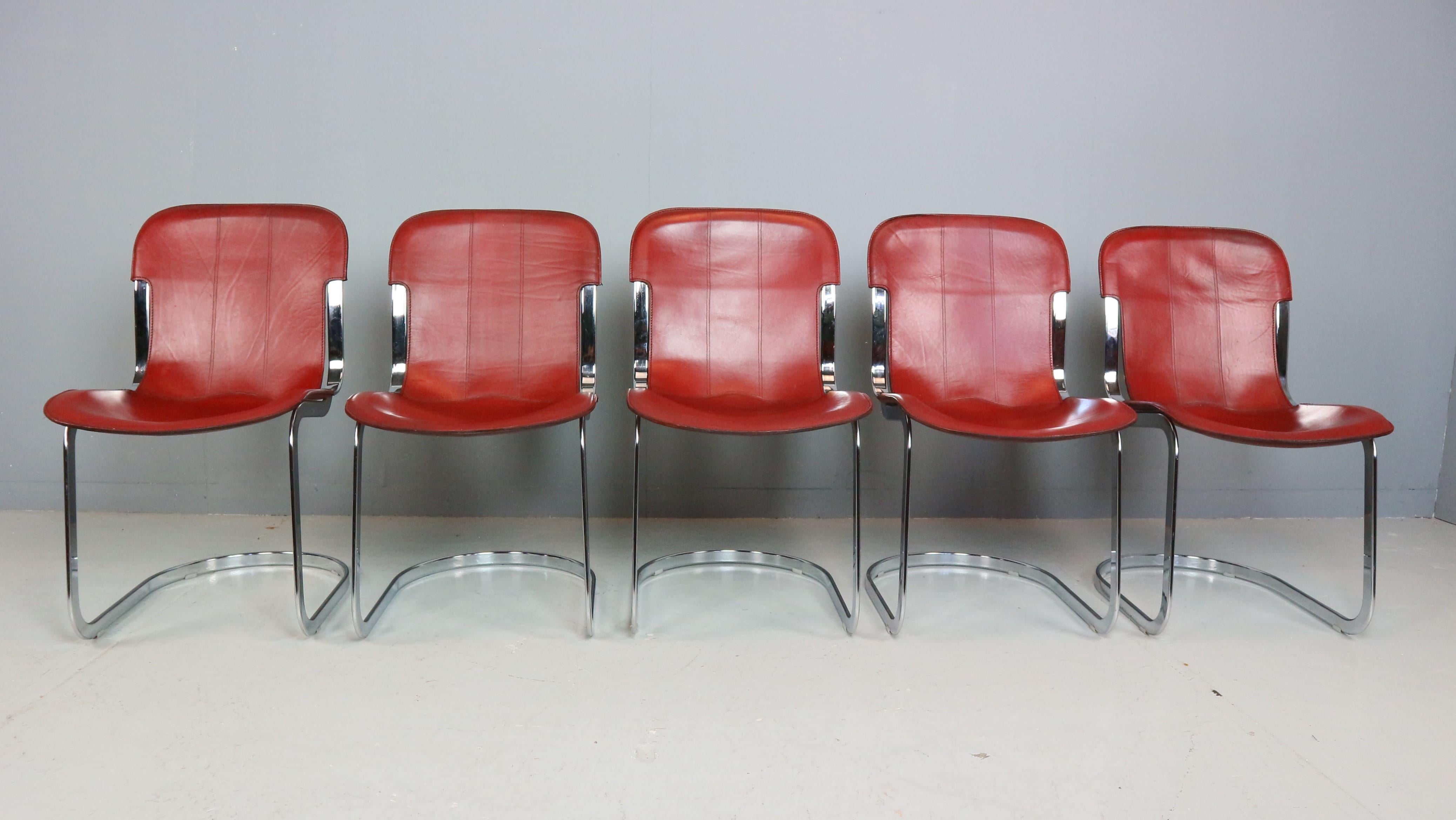 Beautifully patinated dark red/brown dining-room chairs by Willy Rizzo for Cidue. As we are used from Willy Rizzo we see a good combination between the two materials used in this chair: Chrome and leather, actually two opposites, but they work very