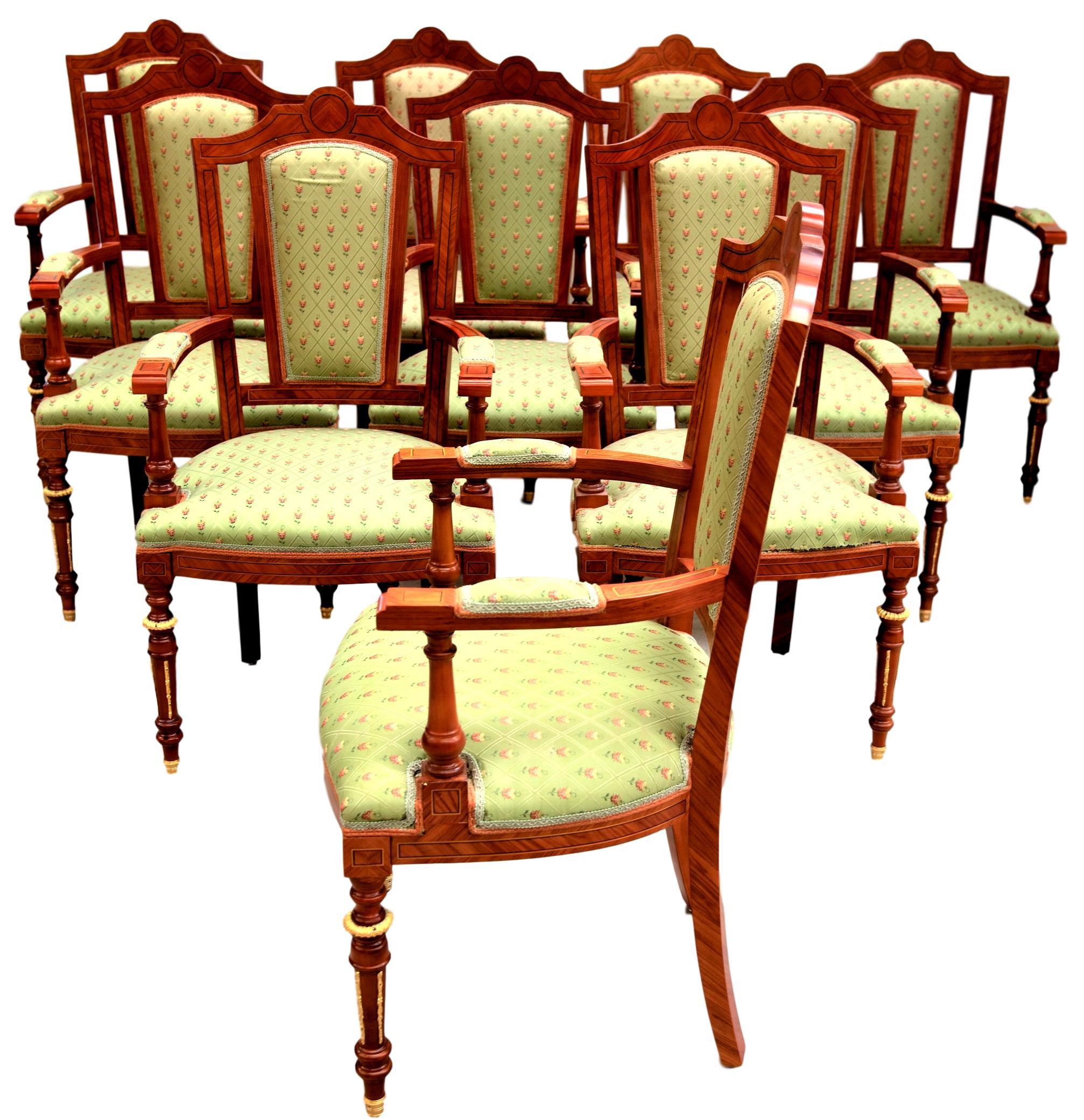 Set of 50 superb dining chairs, upholstered in green decorated fabric, in Rosewood with inlaid decorations and gilt bronze details. made in Italy, circa 1990s.

These elegant dining chairs show traditional and classic design aesthetic lines with