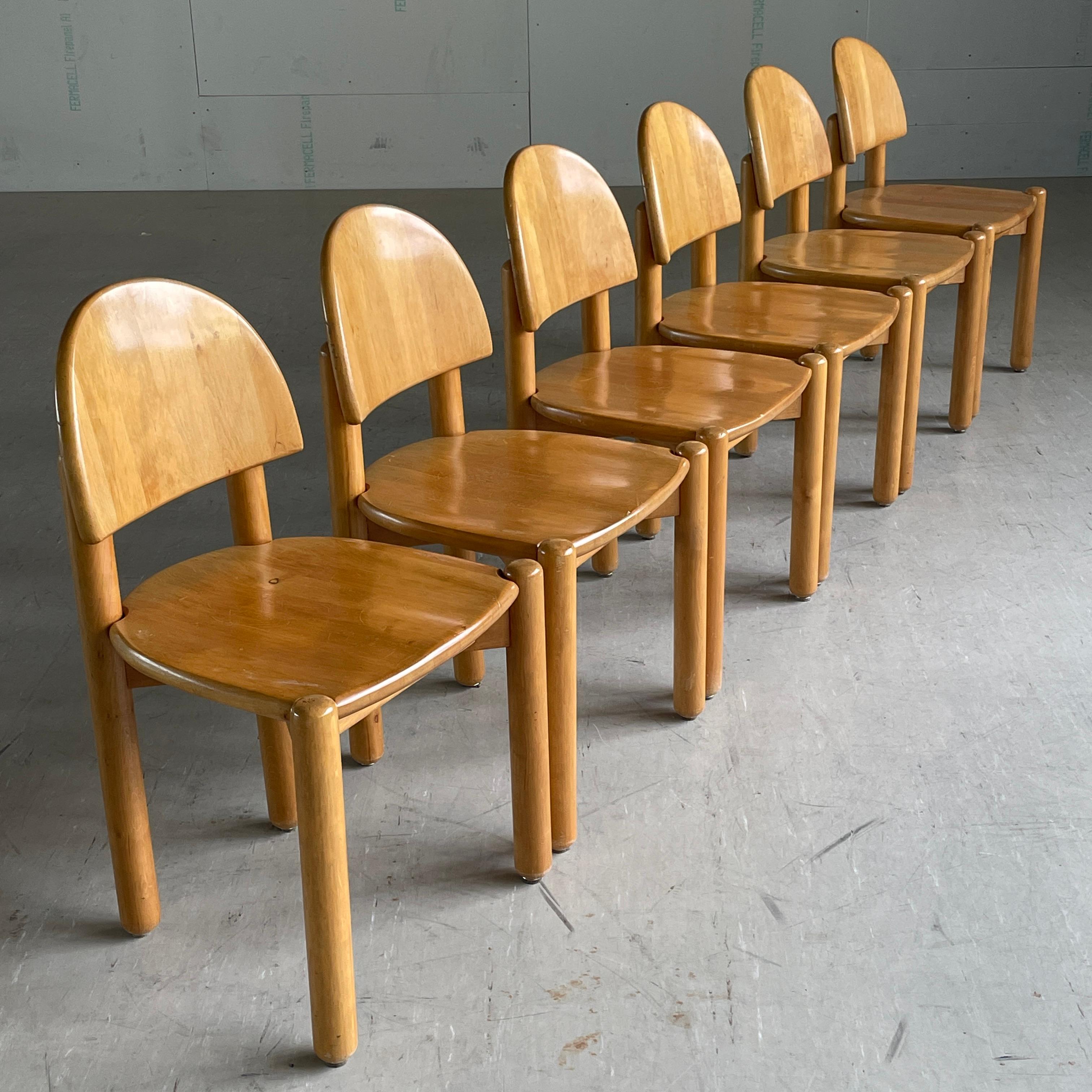 Setof 6 1970's Rainer Daumiller Danish modern dining chairs. Solid beechwood construction. Curved backrest, recessed seat with cylindrical lags. Scandinavian minimalism in Brutalist style. Lovely wood grain and colouring. Produced by Hirsthals