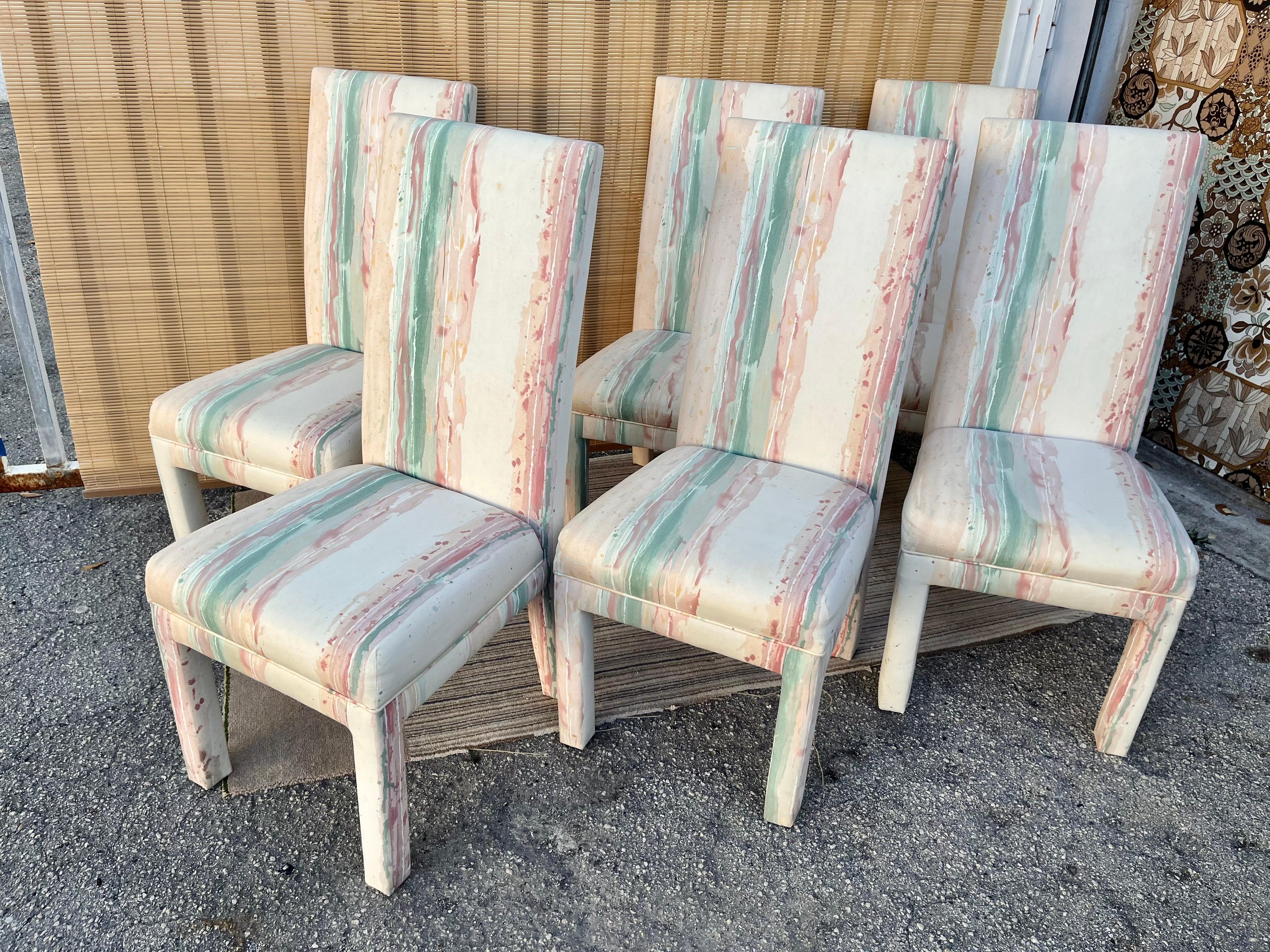 A set of Six Postmodern sculptural high back fully Upholstered dining chairs. Circa Mid 1980s 
Feature the original 1980s sponged and splatter pattern upholstery in pastel cream, peach, tan, and teal tones.
In excellent near mint original