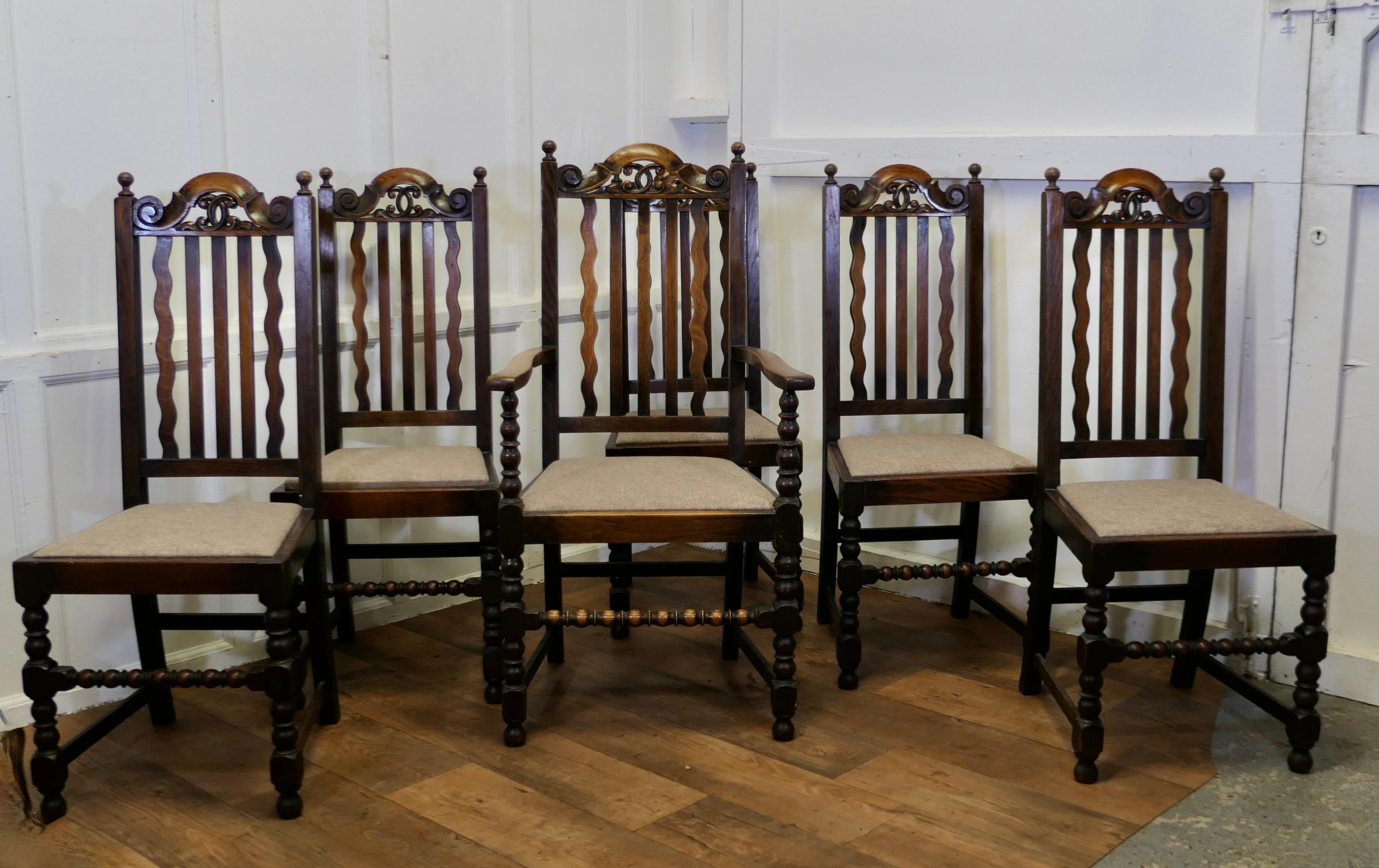 Set of 6 19th Century Country House Oak Dining Chairs 

This is a very handsome set of High Back Country Oak Chairs, one of which is the carver chair 
These handsome Oak frames have turned legs and bobbin turned front stretchers, they have slatted
