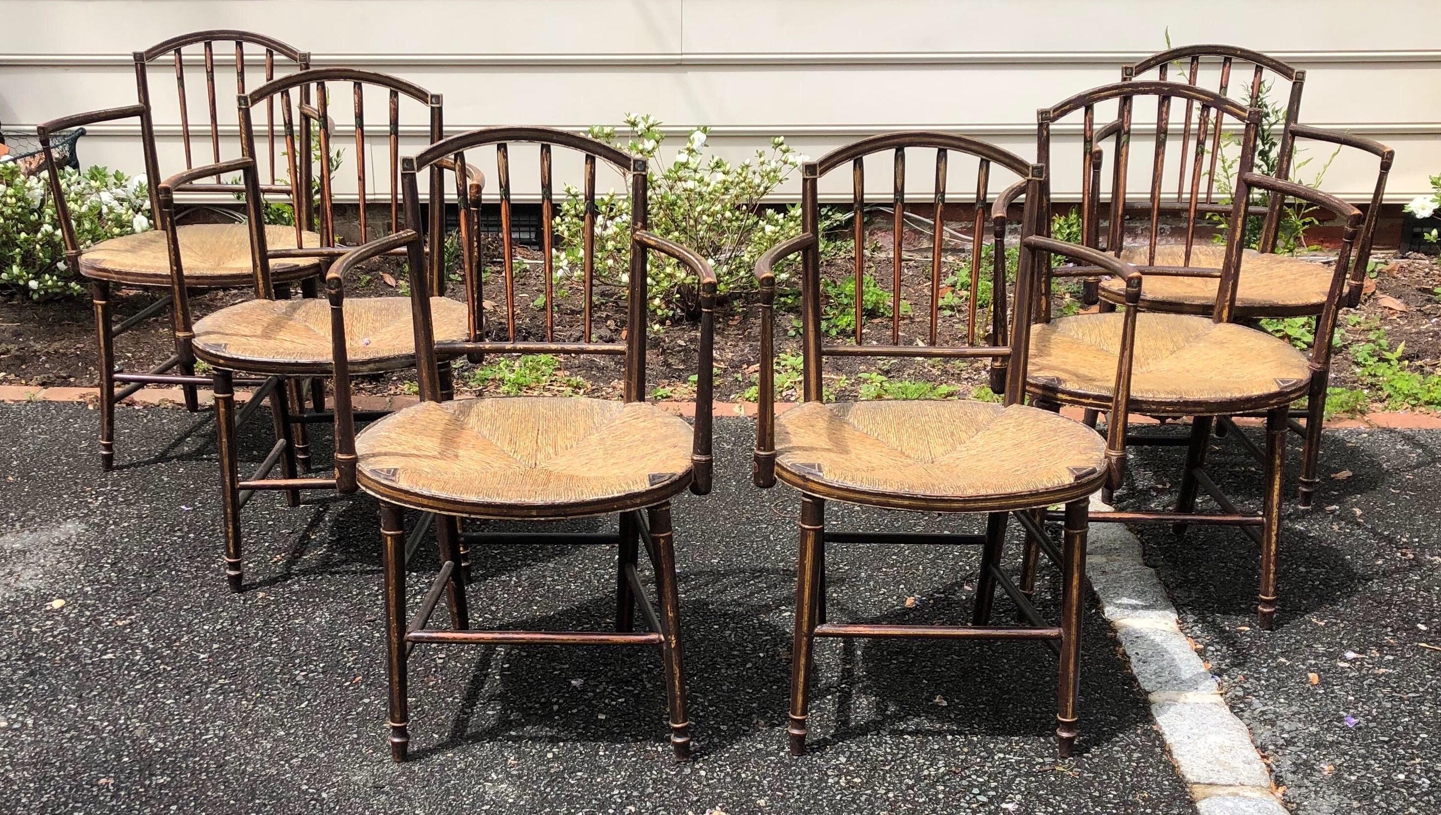 Beautiful set of 6 19th century English Regency armchairs in original paint. Nice, wide and comfortable chairs. Rush seats are in excellent shape- can be used as is or plenty of room to add a cushion.