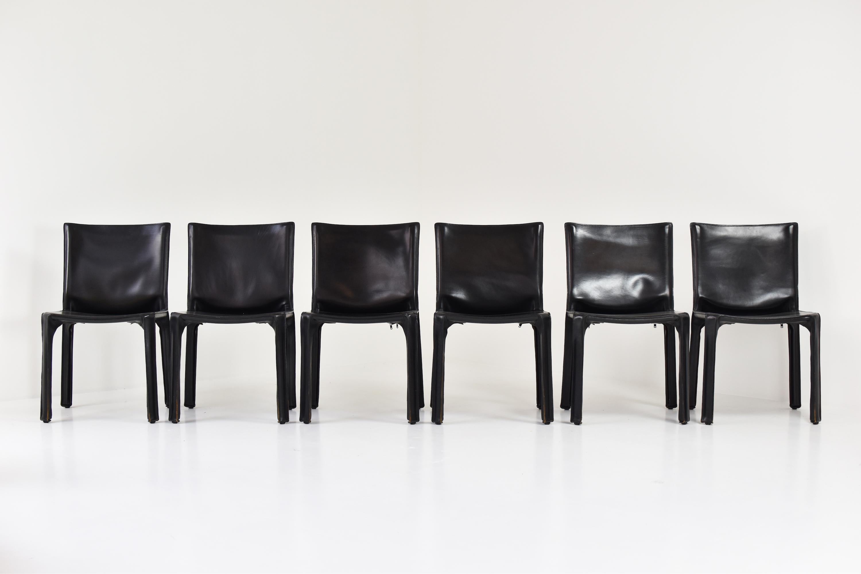 Set of 6 “413” CAB chairs designed by Mario Bellini and manufactured by Cassina, Italy, 1977. These high-quality chairs consist of handstitched black leather upholstery wrapped over an internal steel frame. Very good original condition. Labeled.