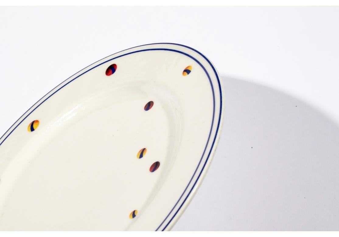 Set of six porcelain plates designed by Adam D. Tihany for Le Cirque and made by Villeroy & Boch. The plates are decorated with yellow circus big tops flying red flags and scattered colorful balls with double blue trims. Marked on verso 