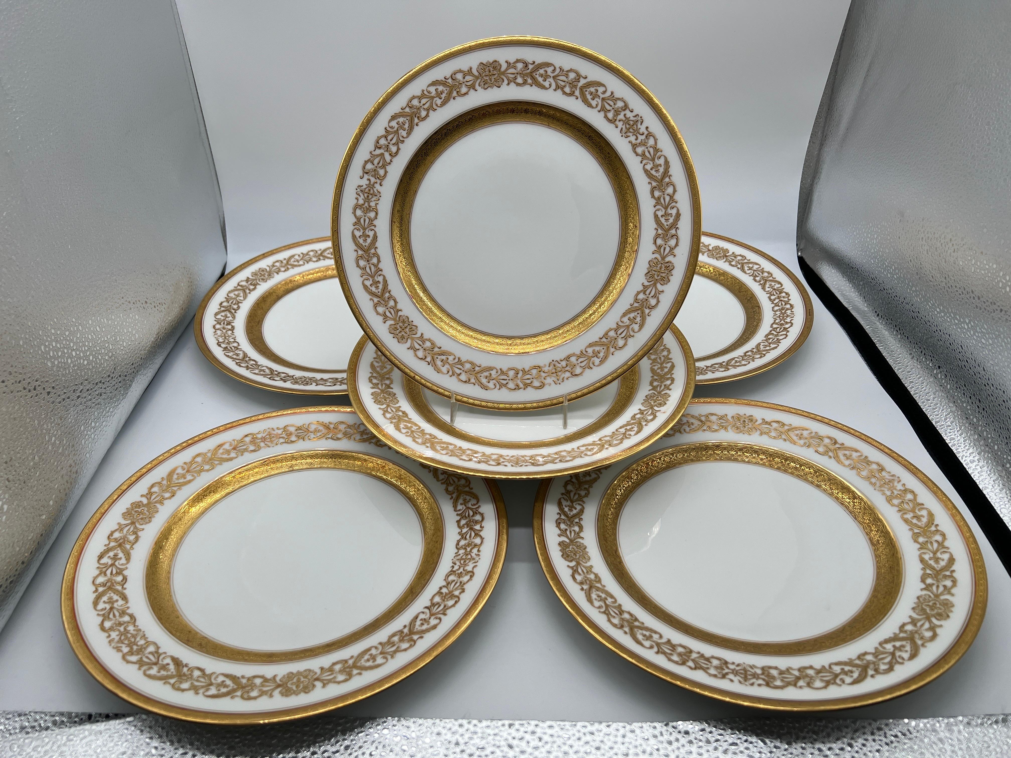 Charles Ahrenfeldt (French Limoges, 1884-1969) for Richard Briggs Company (American, 1798-1946). Mark dates 1894-1930. 

An extremely fine quality set of six (6) porcelain plates heavily decorated with gold leaf across surfaces and a foliate