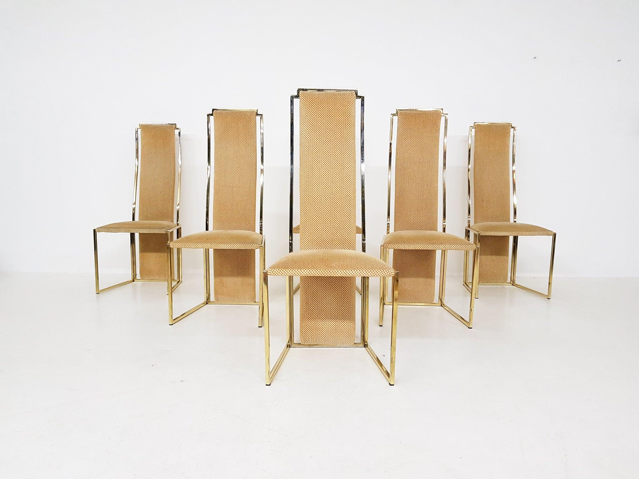 Chaises de salle à manger haut de gamme à dossier haut en métal doré d'Alain Delon. Fabriqué et conçu en France dans les années 1980.

Un ensemble de six chaises de salle à manger en métal doré et en tissu. Les chaises ont des formes géométriques