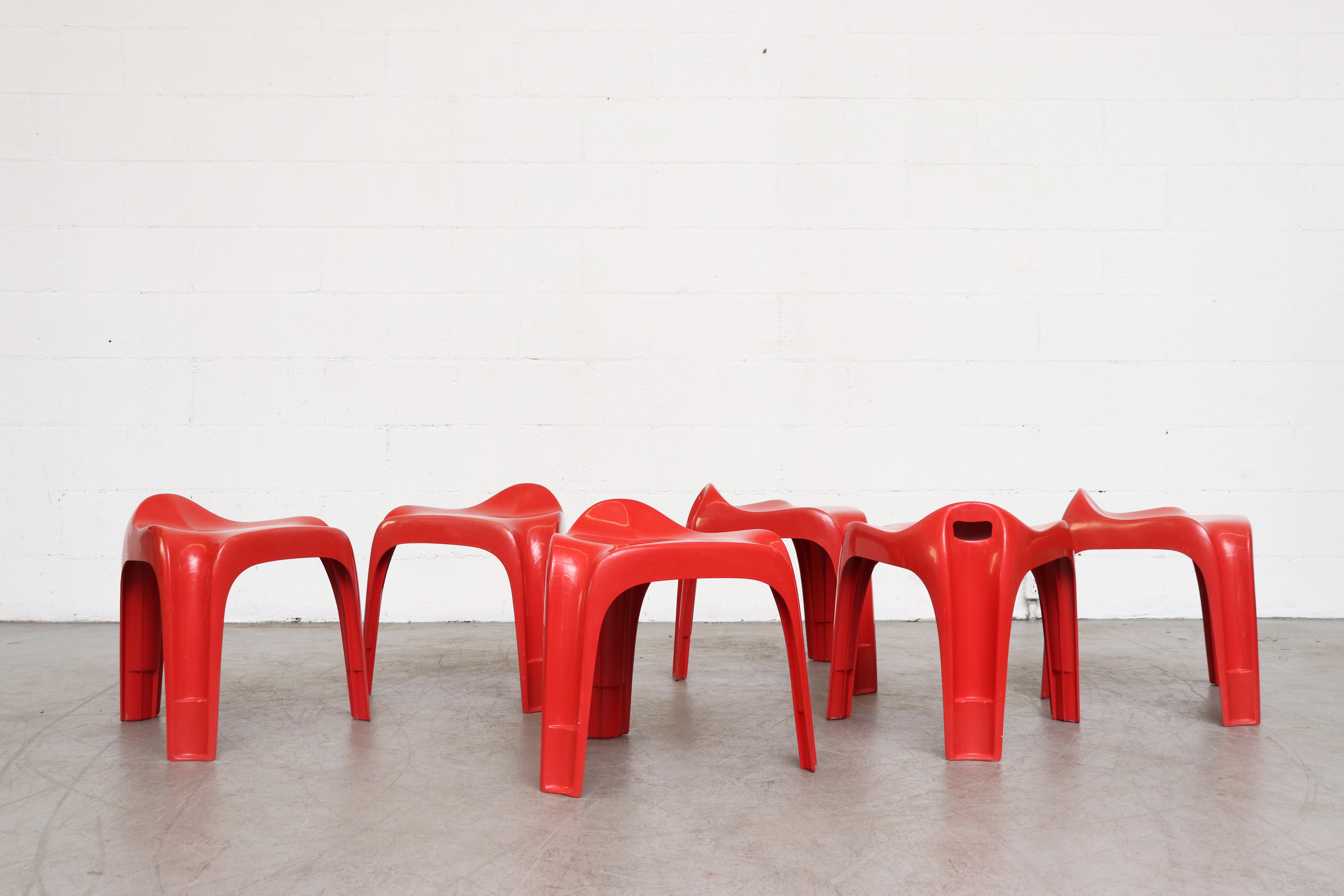 Set of 6 vintage Casalino molded red plastic stools by Alexeander Begge for Casala, circa 1970. In original condition with visible wear. Set price.