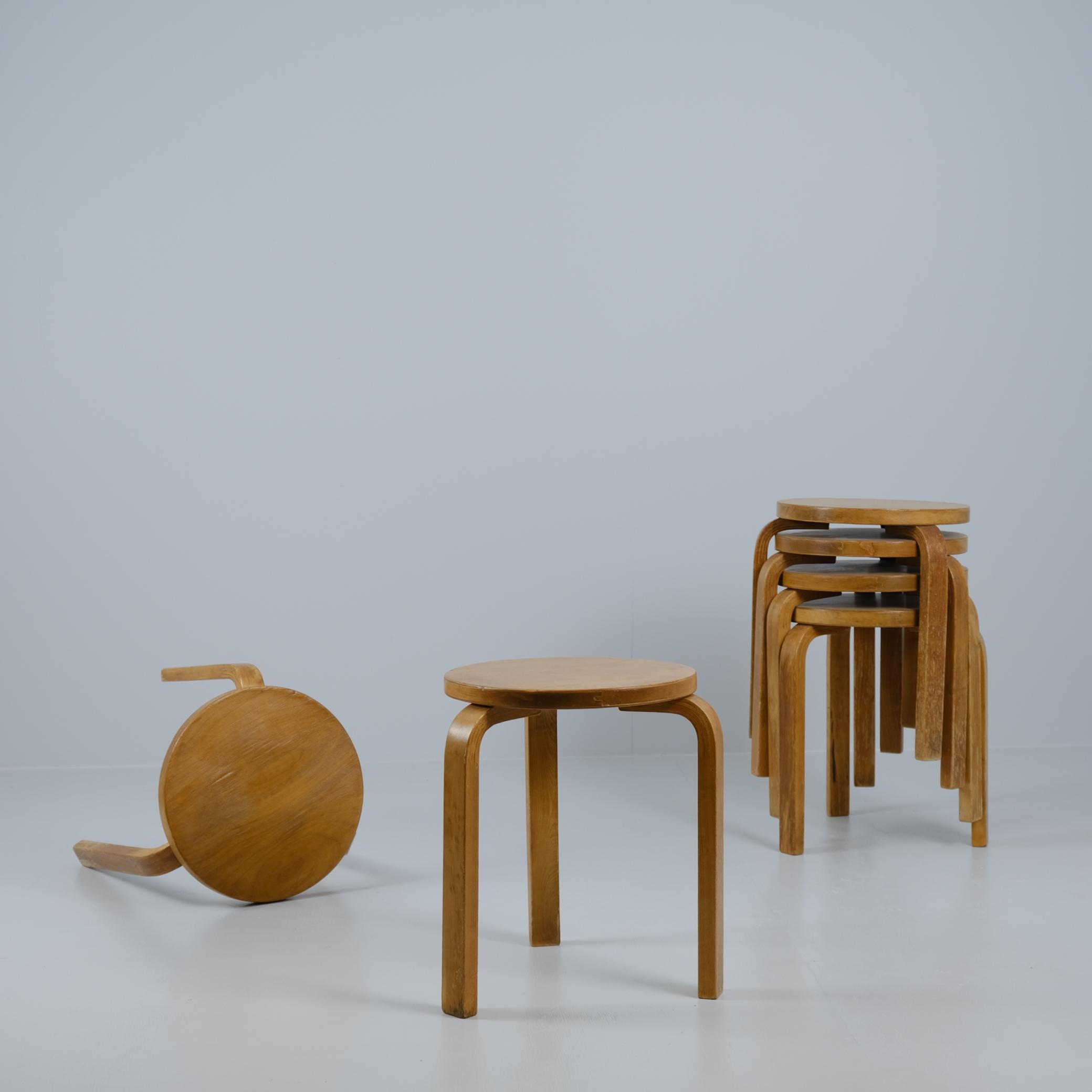 These six Alvar Aalto iconic stools from 1930s are beautiful and space saving furniture pieces of timeless design. The legs are mounted directly to the underside of the round seat without the need for complicated connecting elements. The stools can