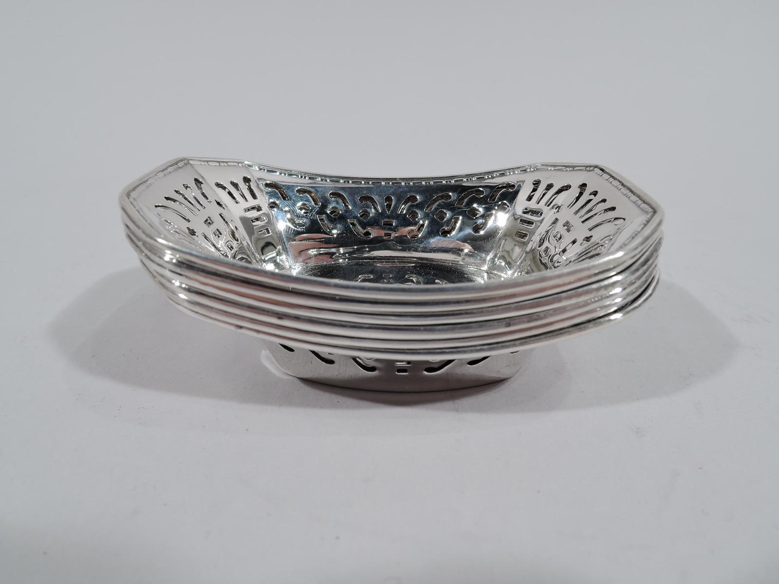 Set of 6 Art Deco sterling silver nut dishes. Made by Webster in Attleboro, Mass, circa 1920. Each: Rectilinear with chamfered corners and tapering sides. Bead-and-reel rim. Pierced geometric ornament. Fully marked. Total weight: 2.5 troy ounces.