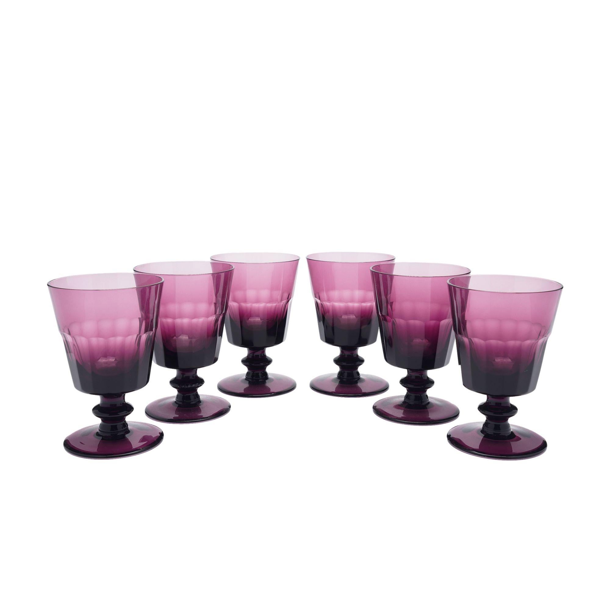 Set of six amethyst goblets with a slice cut bowl on a knobbed pedestal supported by a circular foot. Pattern now discontinued.
Maker's mark etched on the underside of the foot.
England, 1980-90.