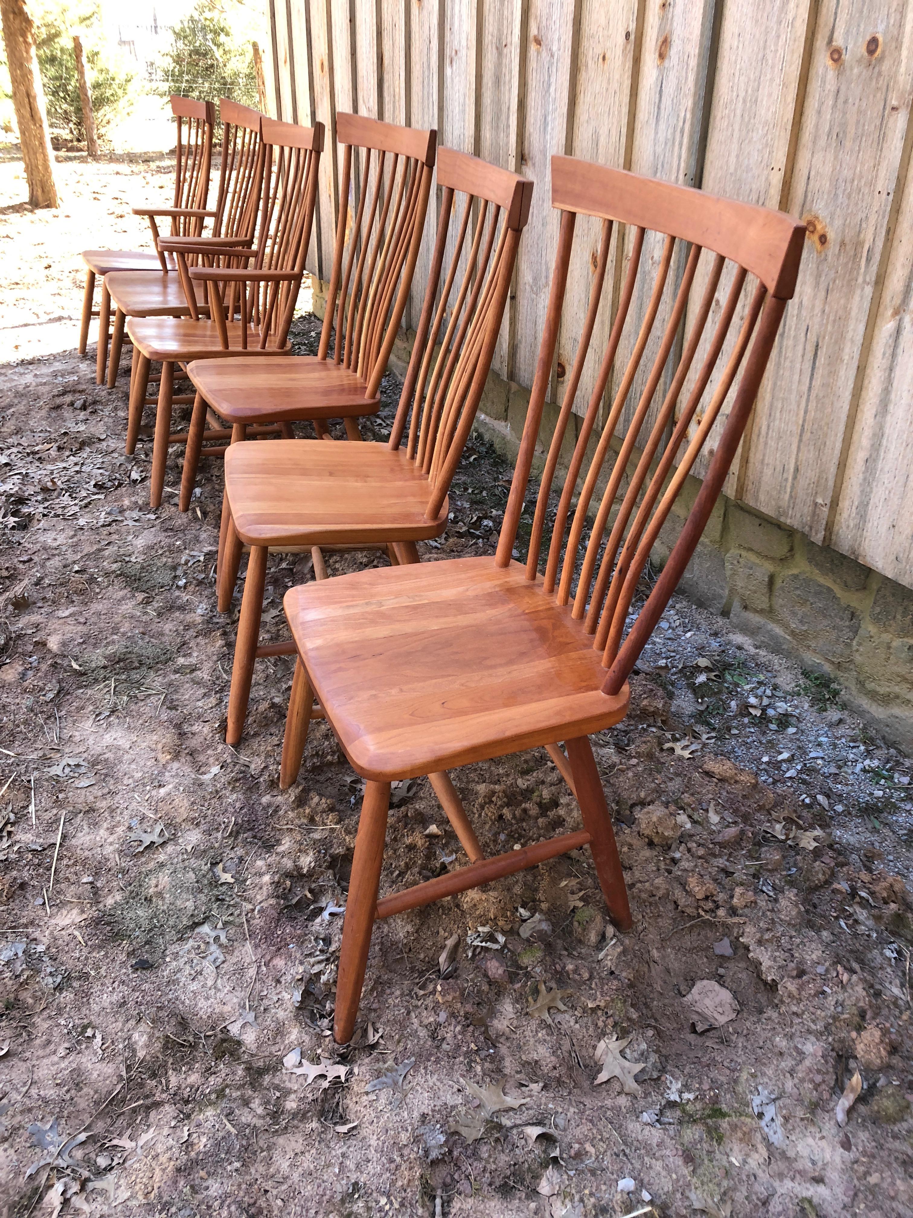 A Classic set of handcrafted Cherry Amish style dining chairs signed under the seats by Eli Hostetler.
Armchairs are 23.5 W arm to arm 39.75 H, 17.25 D, seat height 17.71, arm height 26.