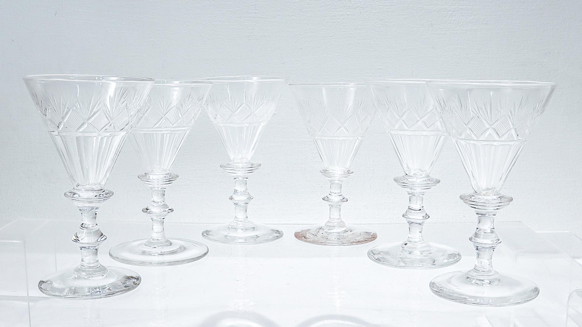A fine set of 6 antique cut glass wines.

Each having wafer bases supporting knop stems and fluted strawberry and fan cut tops.

Attributed to Bakewell, Page, & Bakewell of Pittsburgh, PA. For related examples see George & Helen Mckearin's 