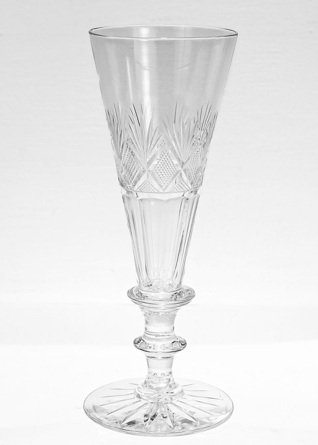 A fine set of 6 antique cut glass champagne flutes.

Each having starcut bases supporting knop stems and fluted strawberry and fan cut tops.

Attributed to Bakewell, Page, & Bakewell of Pittsburgh, PA. 

For related examples see George & Helen