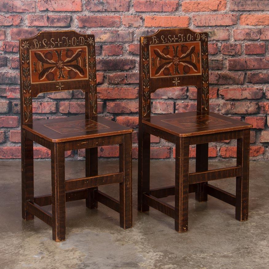 It's unusual to find an intact matched set of these small country chairs with a distinct cottage feel. The traditional earth tone paint has a remarkable time worn patina and is all original. With organic floral accents in the seats and backs of each
