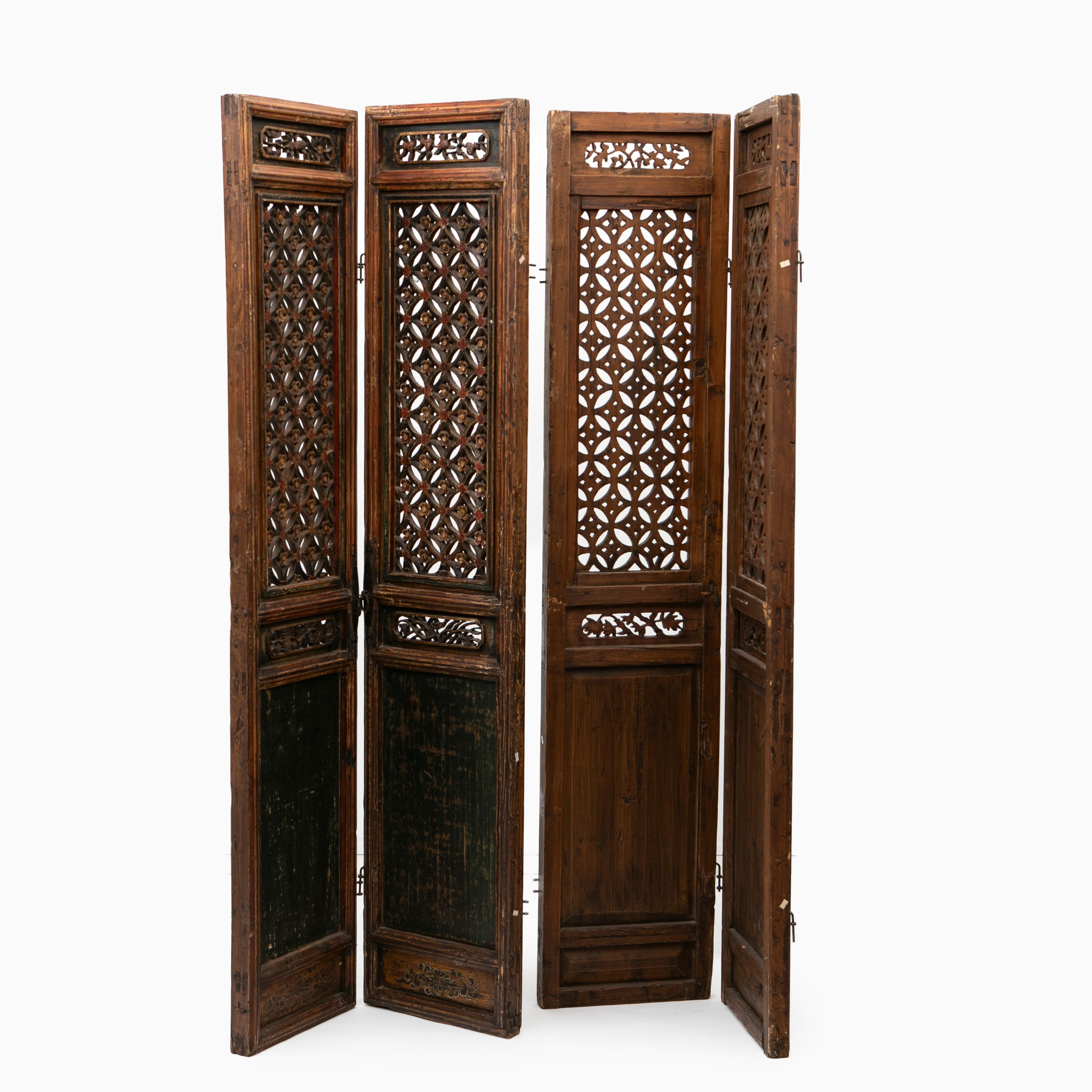 Set of six wood carved Chinese 17-18th century Qing dynasty panels or room divider.
Each panel features an main section with an open fretwork design lattice panel window, comprised by a pattern of a connecting cherry blossoms. Relief foliate lattice
