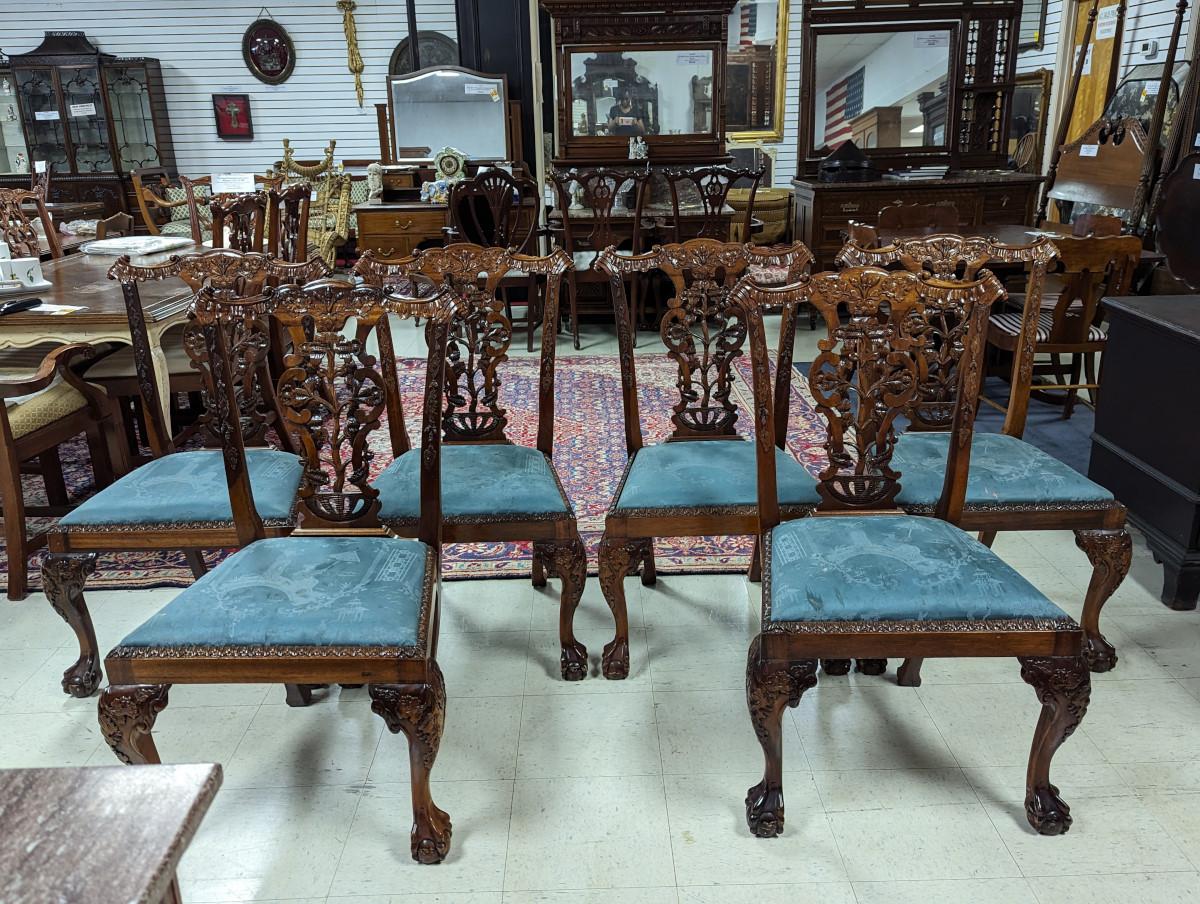 6 Armless chairs, Intricately carved back splat, Tree, leaves, and acorn carvings, Upholstered drop in seats, Front legs have carved knees with ball and claw feet. 
