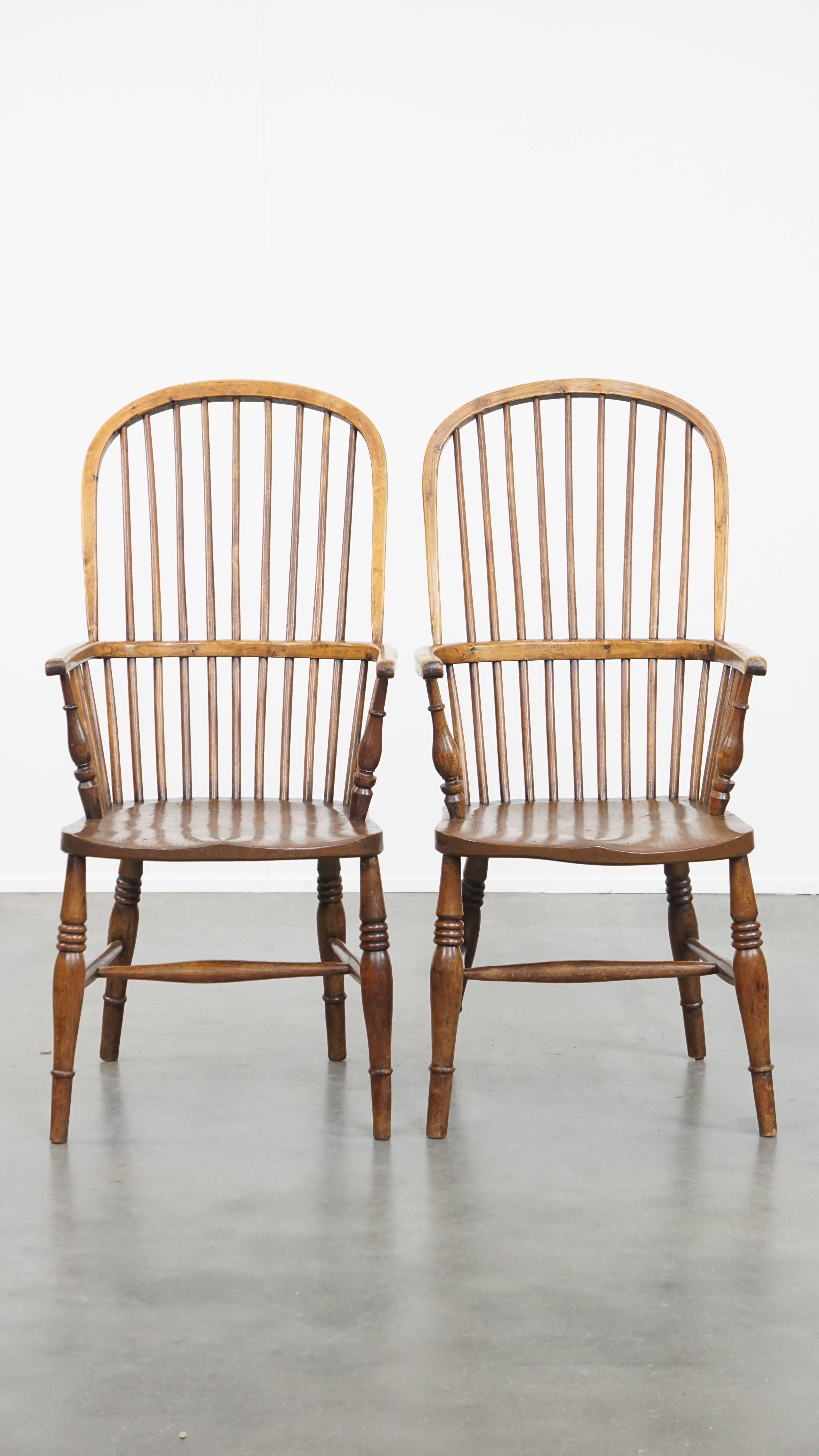 Offered: this wonderful set of six antique English Windsor stickback chairs from the 19th century, crafted from elm. These charming antique Windsor chairs are not only ideal for use in a home setting, but also perfectly suited for hospitality or