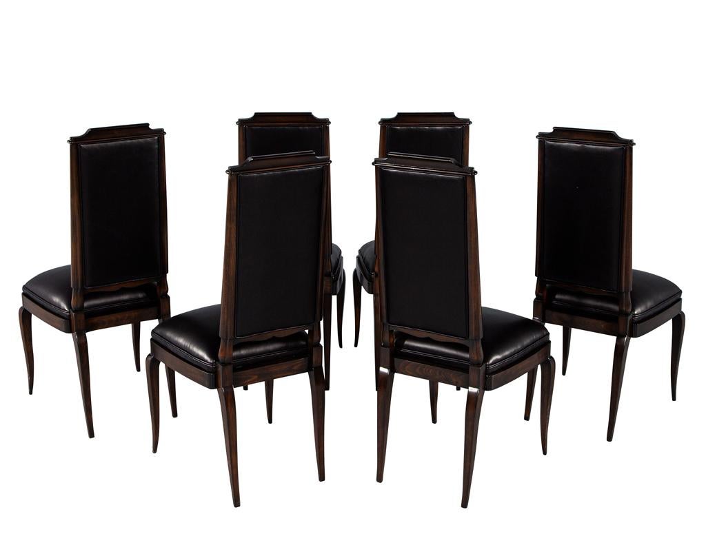 Introduce a touch of elegance and sophistication to your dining space with this stunning set of 6 antique French art deco dining chairs. These chairs exude the iconic art deco styling that was popular in the 1940's, making them a truly timeless