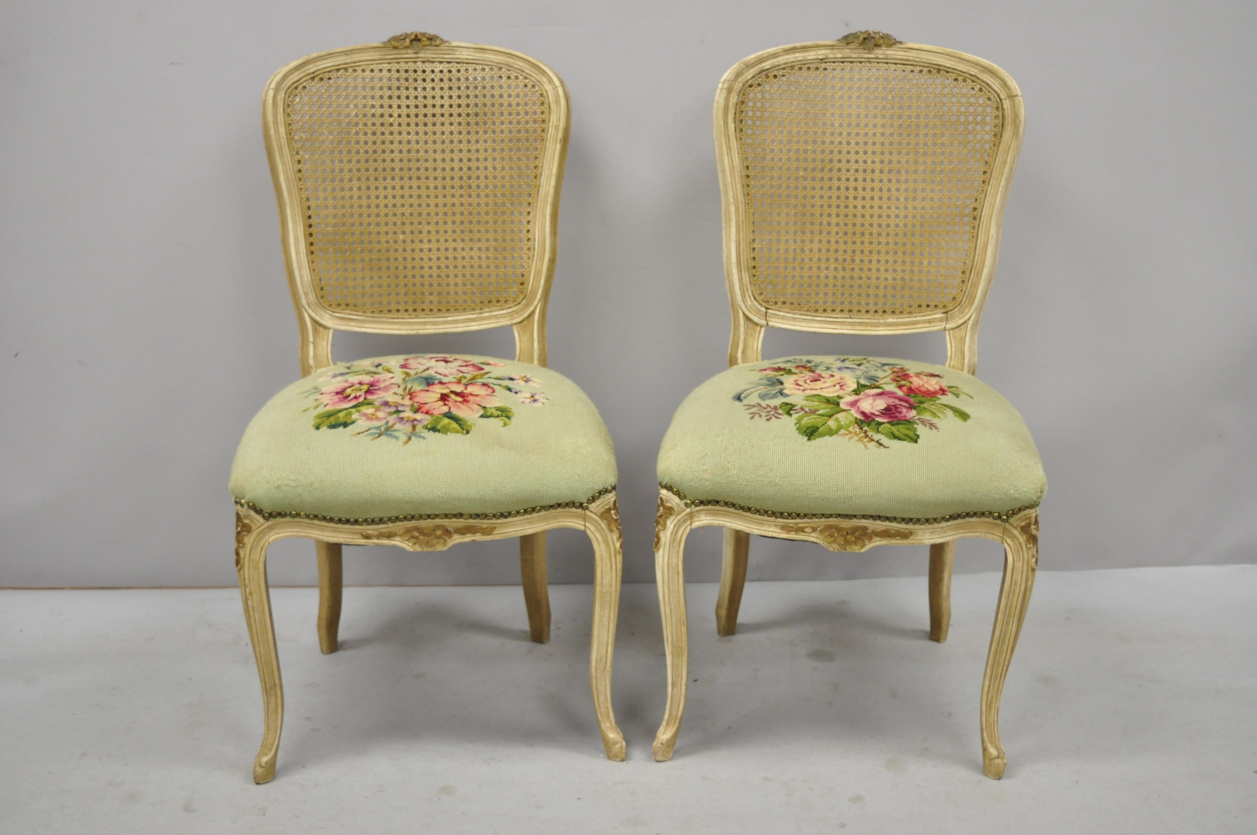 Set of 6 antique French Louis XV style Victorian cane back dining side chairs. Listing includes cane backs, floral needlepoint seats, solid wood frame, cream distressed finish, nicely carved details, cabriole legs, circa early 20th century.
