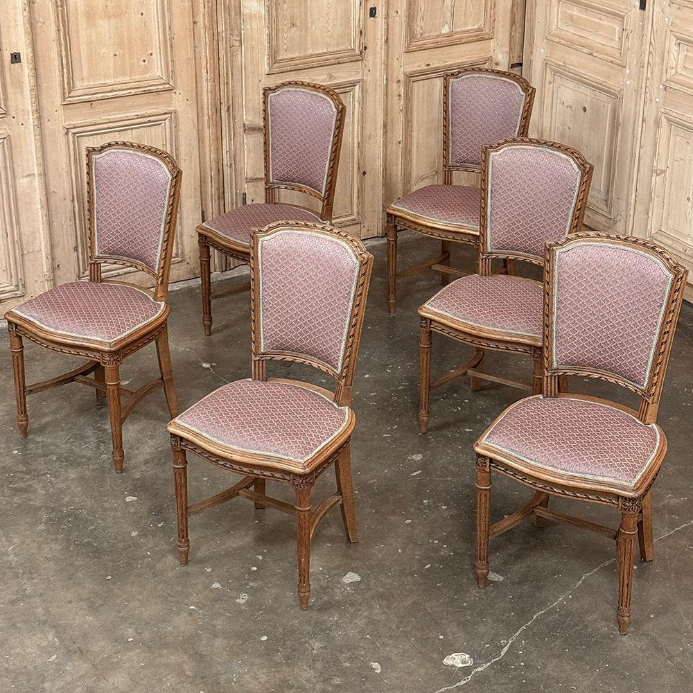 Set of 6 Antique French Louis XVI Dining Chairs are the perfect blend between elegance and a casual formality that works so well with today's lifestyles!  Hand crafted from solid oak, the lines are tailored with keystone-shaped seatbacks contoured