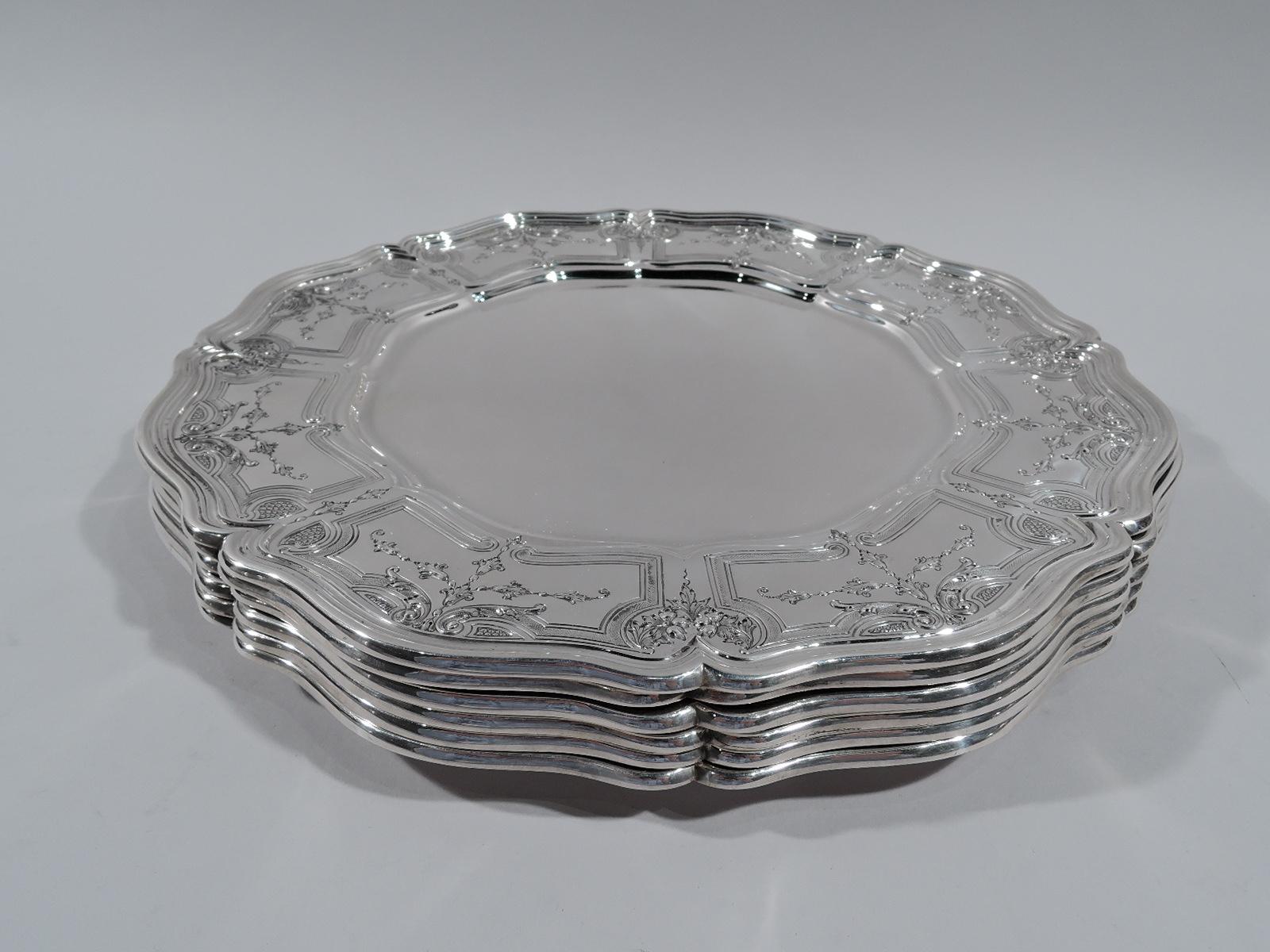 Set of 6 Rococo sterling silver dinner plates. Made by Gorham in Providence in 1928. Each: Plain and round ogee well. Wide and tapering shoulder with curvilinear frames inset with chased and engraved garlands and pendant flowers. Molded and scrolled