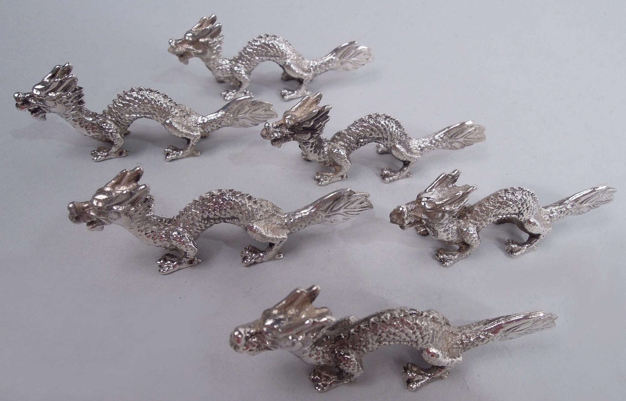 Set of 6 Japanese Meiji silver cast figural knife rests, ca 1910. Each: A horned and taloned dragon with arched back and fan tail. Scaly, scampering serpents for the next dinner party. Unmarked. Total weight: 5 troy ounces. 