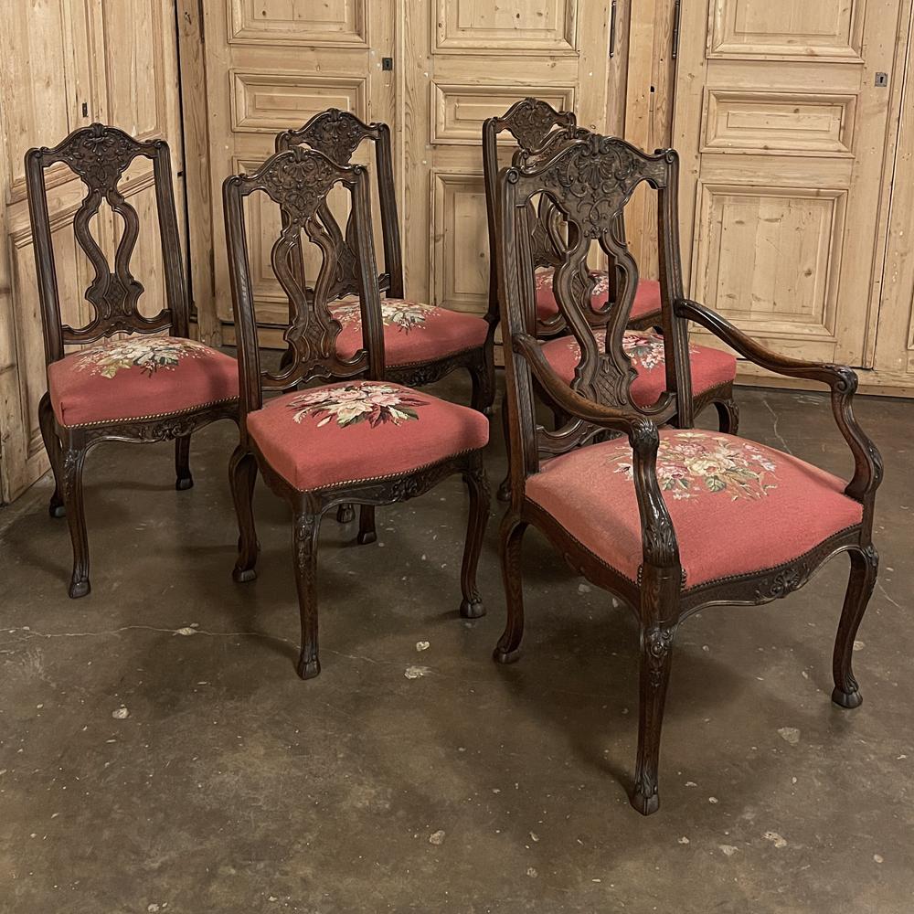 Set of 6 Antique Liegeoise needlepoint dining chairs includes one armchair! The exceptional quality of the set is immediately apparent, each being sculpted from select old-growth oak that is dense and hard to carve but once sculpted by a skilled