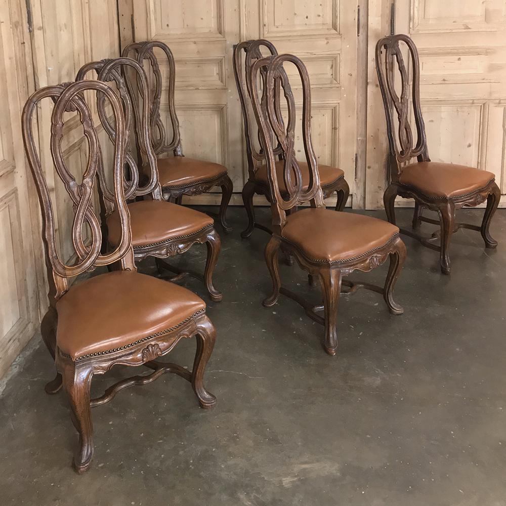 Set of 6 antique Lyre back Queen Anne Dining Chairs were fashioned from fine walnut, and feature an intertwined design hand-sculpted to complement the generously sized seats with faux leather, all supported by contoured and carved cabriole legs and