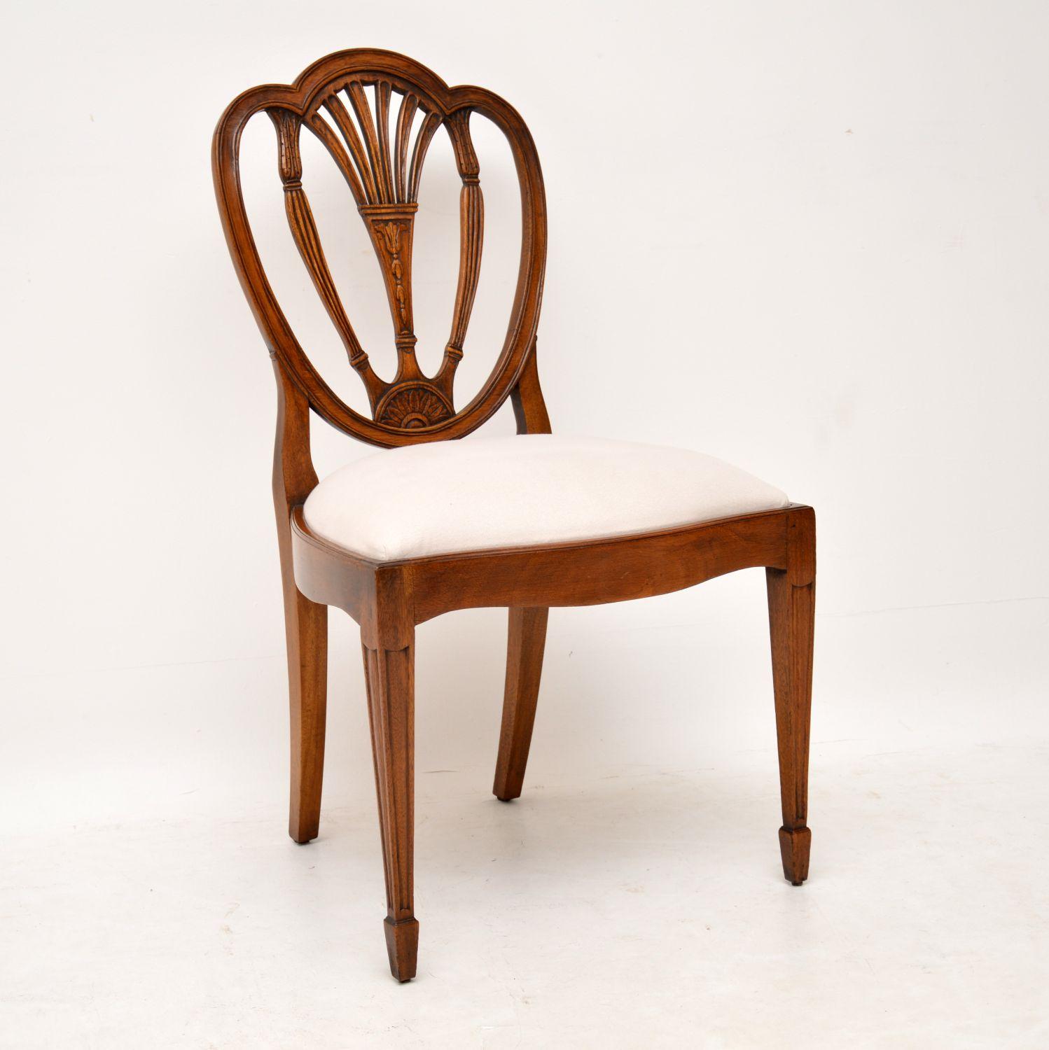 This set of six antique mahogany dining chairs are of high quality and have nicely shaped backs with intricate carvings all-over. They are in excellent condition, having just been French polished and have a lovely warm color. The back legs are swept
