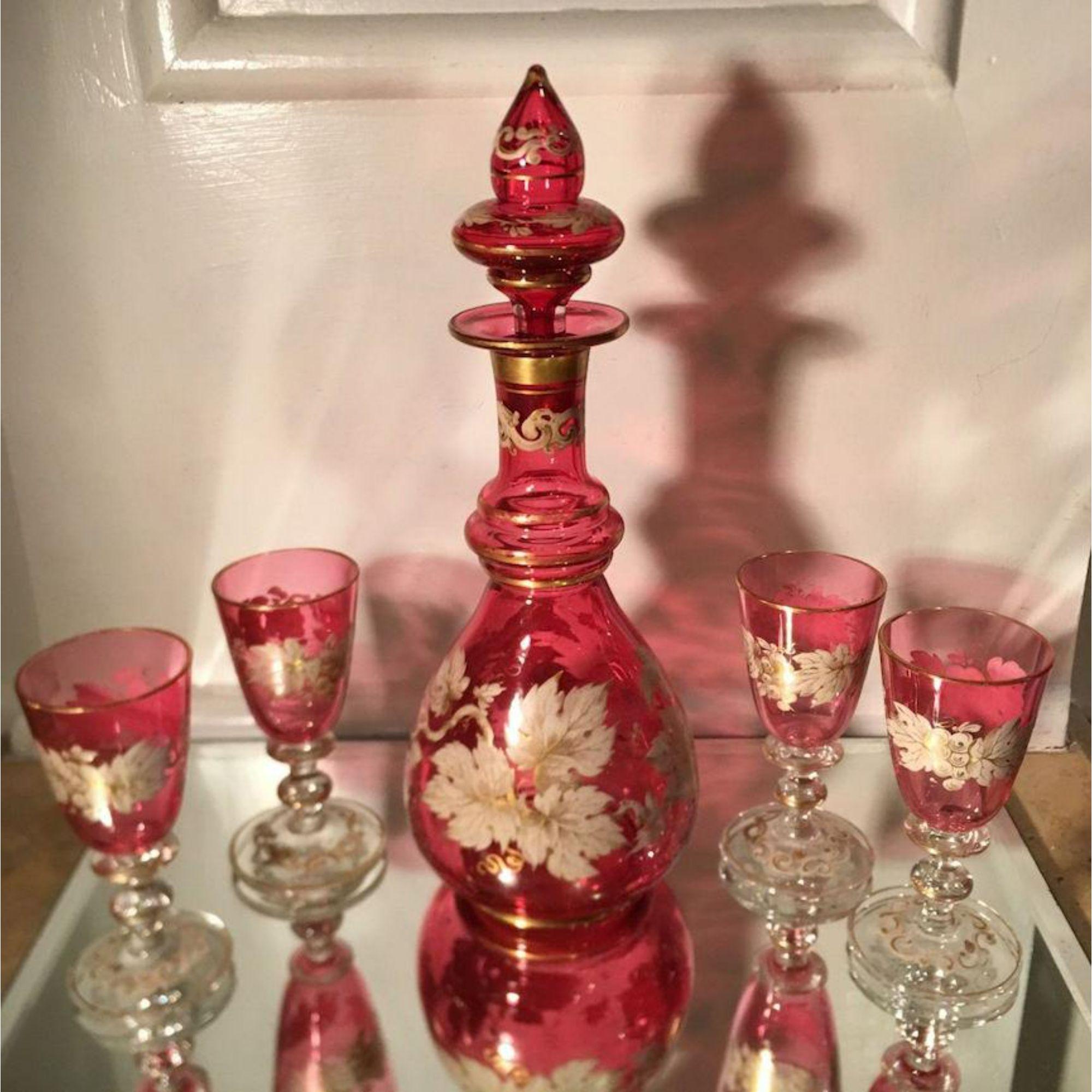 Antique Moser cranberry glass Enamel decorated Cordial Decanter drink set including 4 glasses and a decanter.

Additional information: 
Materials: Enamel, Glass
Color: Ruby Red
Brand: Moser Glassworks
Period: Mid-19th Century
Place of Origin: