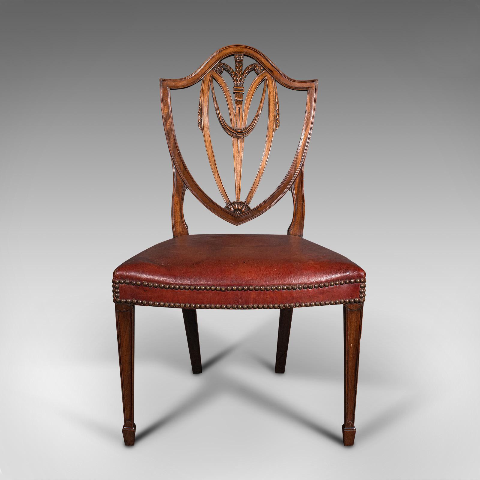 This is a set of 6 antique shield back chairs. An English, mahogany and leather dining seat with Hepplewhite taste, dating to the Georgian period, circa 1800.

Enhance your dining experience with six superb chairs
Displaying a desirable aged