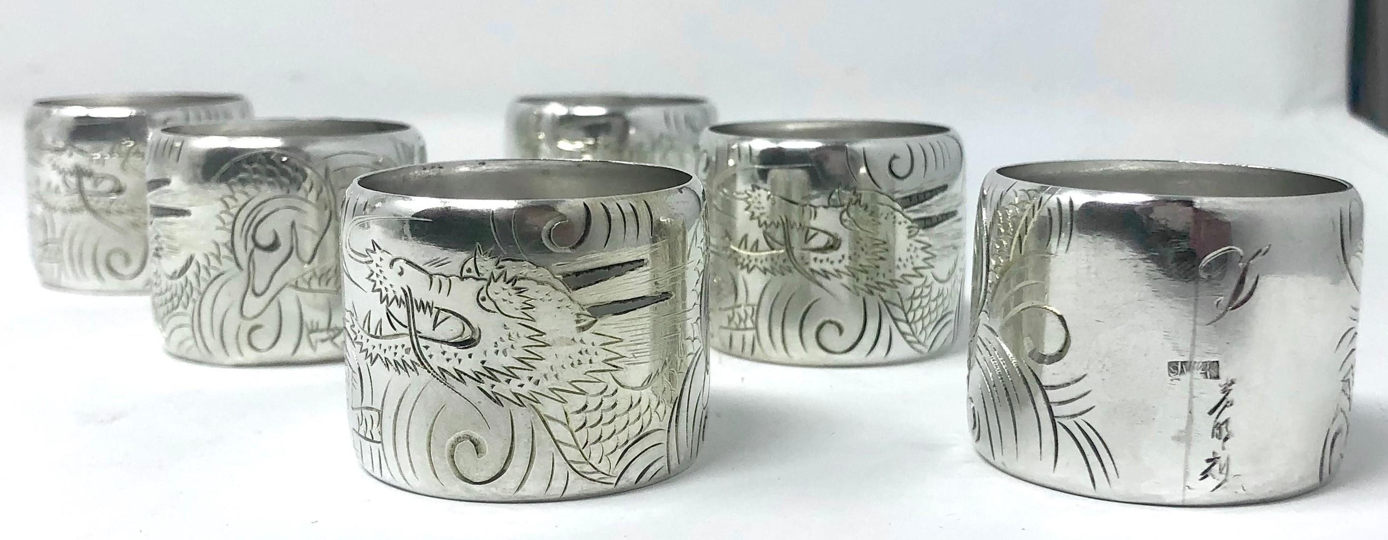 Set of 6 antique sterling silver napkin rings in original box, circa 1910.