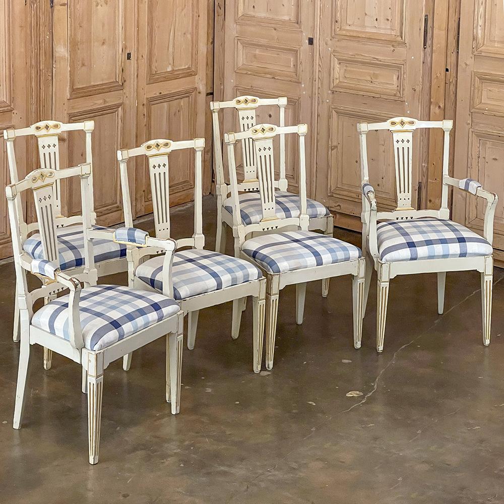 Set of 6 antique Swedish Gustavian painted dining chairs includes 2 armchairs and will make a great addition to your intimate dining accommodations! The tailored design includes slotted vertical back splats housed in a framework that includes an