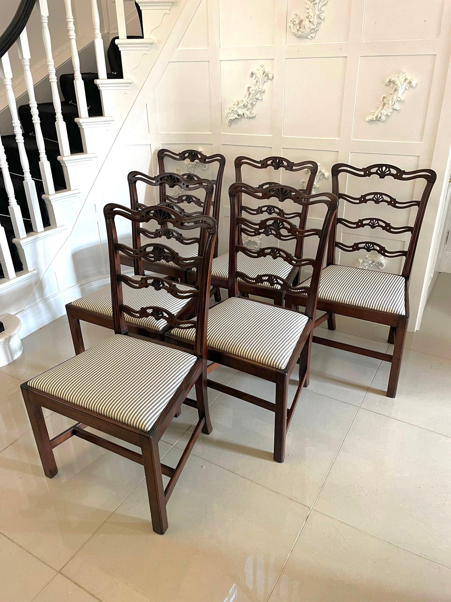 Set of 6 antique Victorian quality mahogany dining chairs having a quality carved mahogany ladder back, newly reupholstered drop in seats in a quality fabric standing on square mahogany legs to the front and out swept back legs united by mahogany