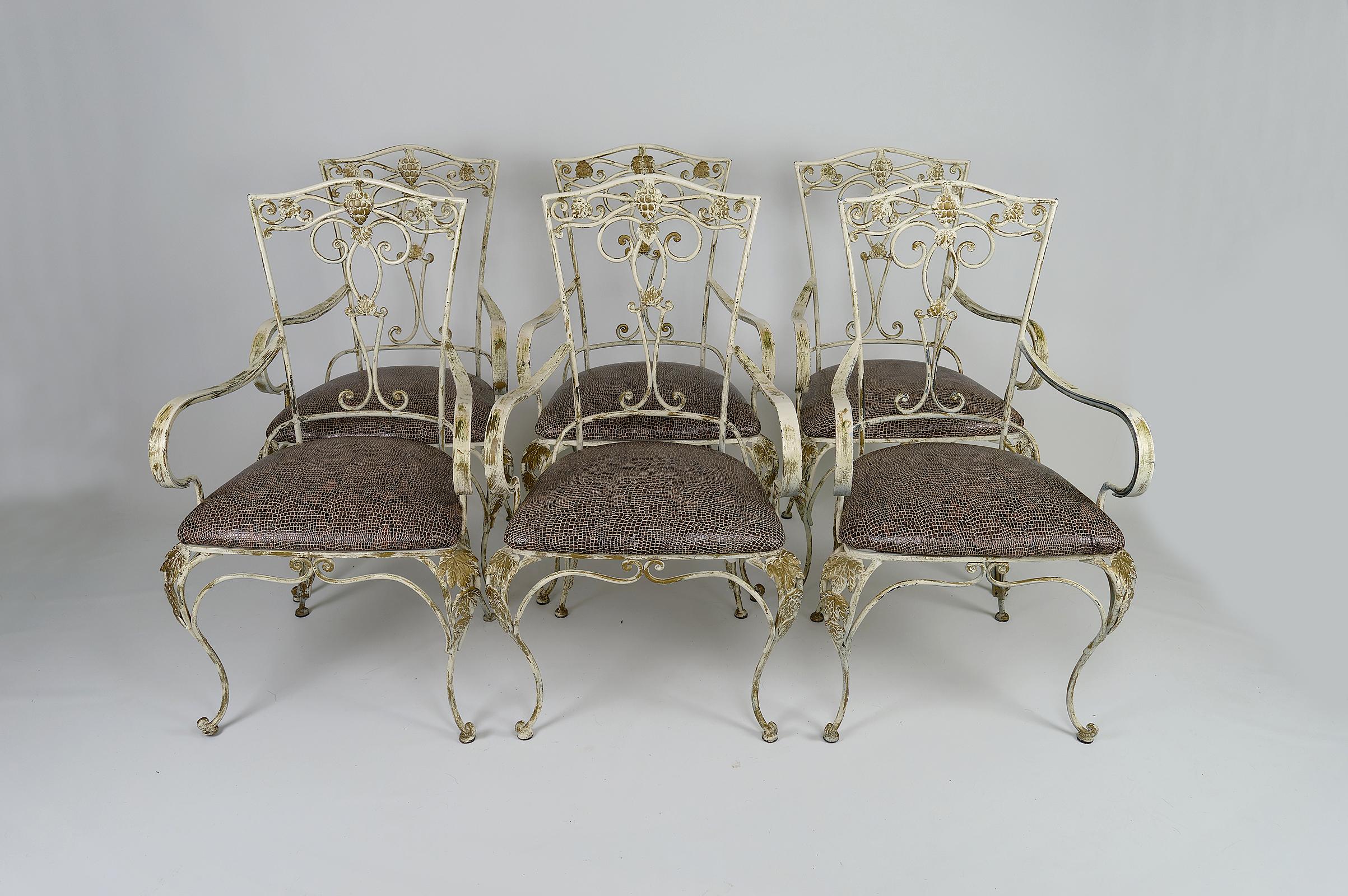 Set of 6 pretty wrought iron armchairs for dining room, veranda or winter garden.
The wrought iron structure is painted white with a golden patina.
The leatherette seats have been redone recently.

Art Deco, France, around 1950.
In the style of the