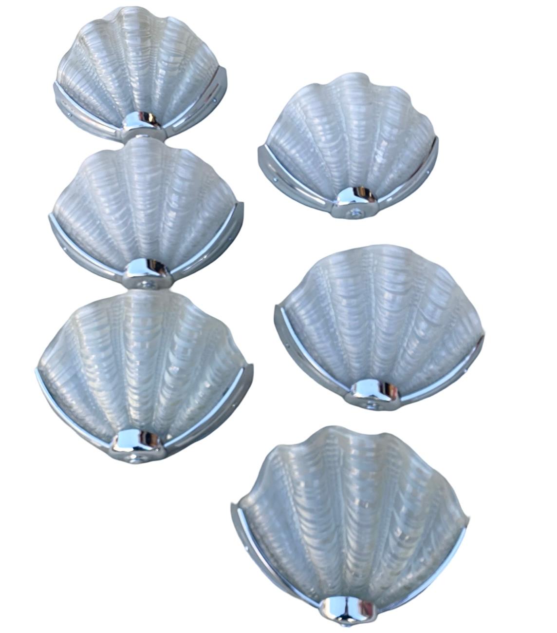 We are excited to offer you this fabulous set of 6 Art Deco Matching shell wall lights in excellent condition. Each frame consists of a chrome surround (all in excellent condition), fixed onto a backplate which screws neatly to the wall. This