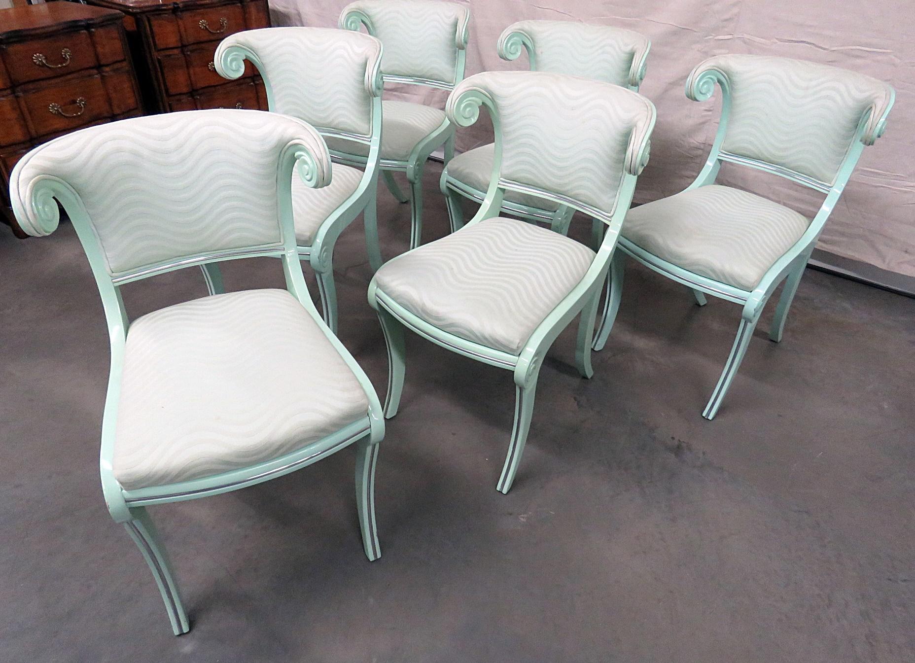 This is a very unique set of dining chairs. Designed in the English Regency manner however with a unique twist of chrome details, these chairs have a traditional feel but with a modern touch. They are perfect for a setting that needs a little of