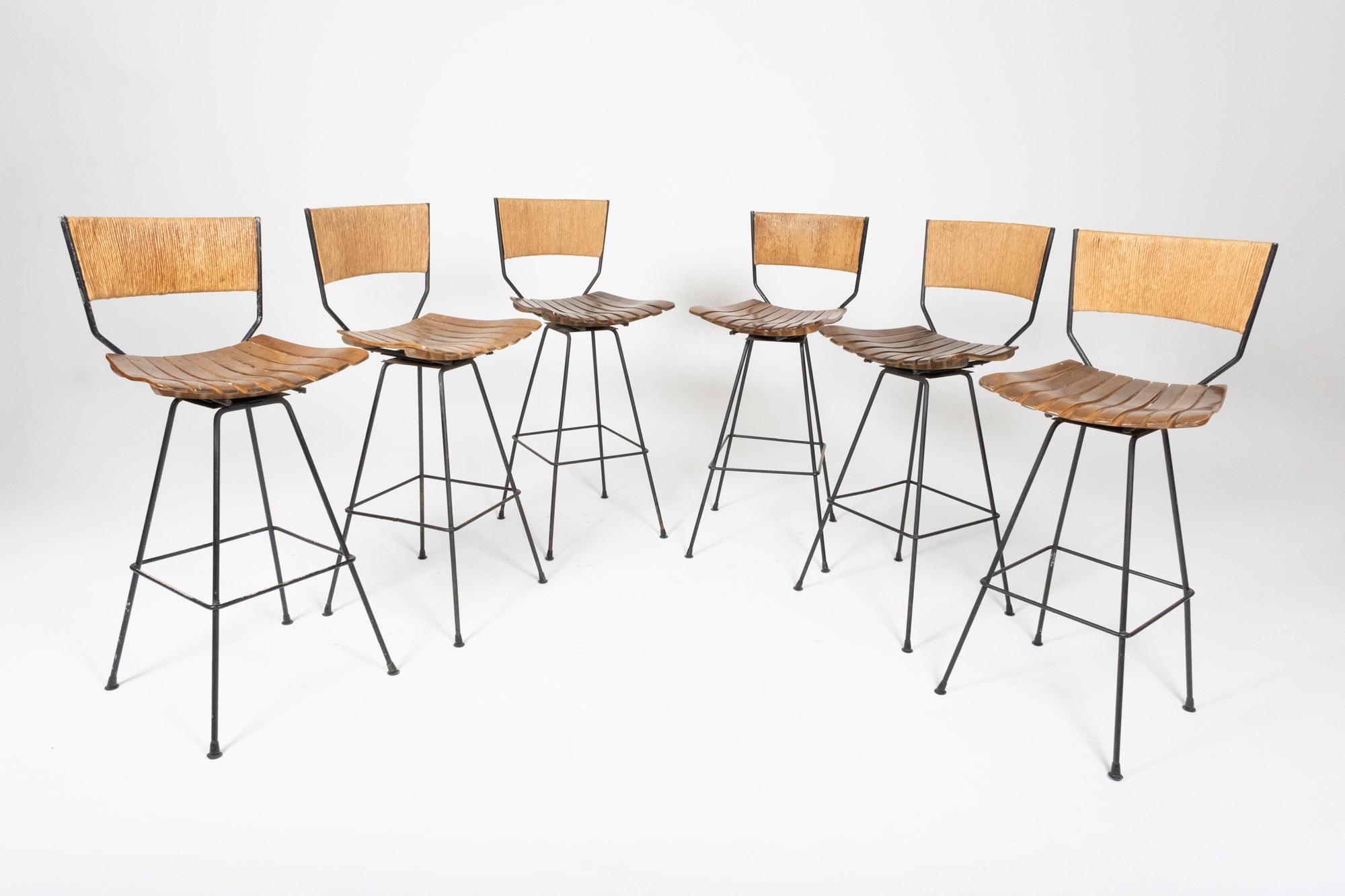 American Set of 6 Arthur Umanoff Swivel Seat Bar Stools in Slatted Wood, Raffia, & Iron For Sale